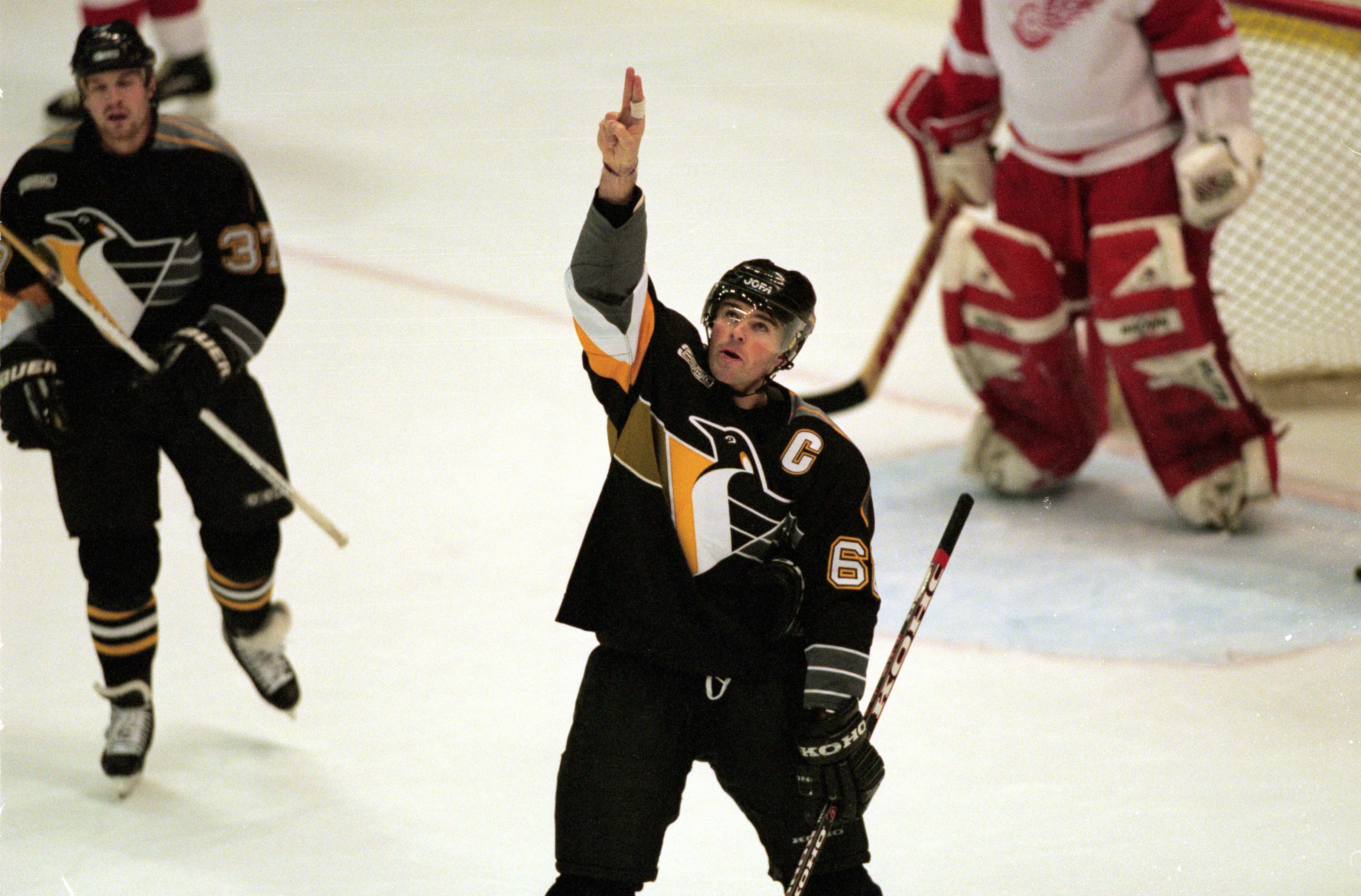 12 Nov 1999: Jaromir Jagr #68 of the Pittsburgh Penguins points and looks up from the ice during the game against the Detroit Red Wings at the Joe Louis Arena in Detroit, Michigan. The Red Wings defeated the Penguins 3-2.