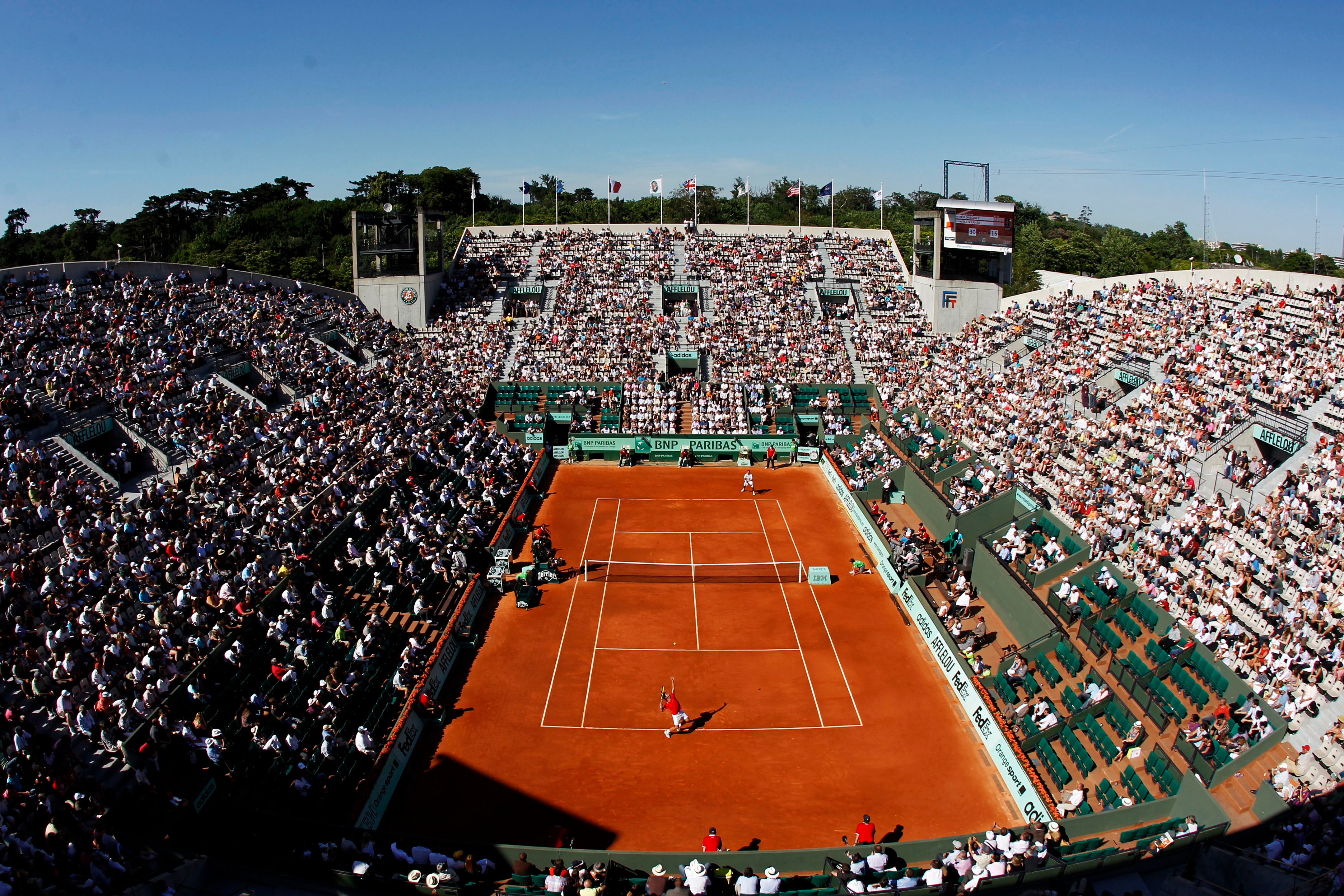 PARIS, FRANCE - MAY 23: A general view of Court Suzanne Lenglen as Richard Gasquet of France serves during the men's singles first round match between Richard Gasquet of France and Radek Stepanek of Czech Republic on day two of the French Open at Roland PARIS, FRANCE - MAY 23: A general view of Court Suzanne Lenglen as Richard Gasquet of France serves during the men's singles first round match between Richard Gasquet of France and Radek Stepanek of Czech Republic on day two of the French Open at Roland