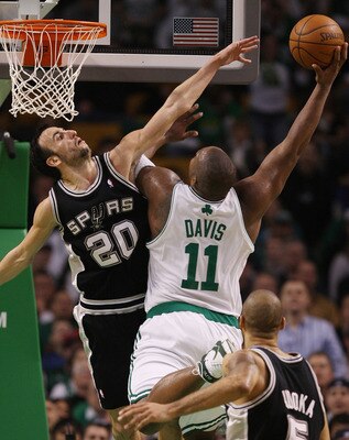 BOSTON - FEBRUARY 10:  Glen Davis #11 of the Boston Celtics tries to get around Manu Ginobili #20 of the San Antonio Spurs on February 10, 2008 at the TD Banknorth Garden in Boston, Massachusetts. The Boston Celtics defeated the San Antonio Spurs 98-90. N