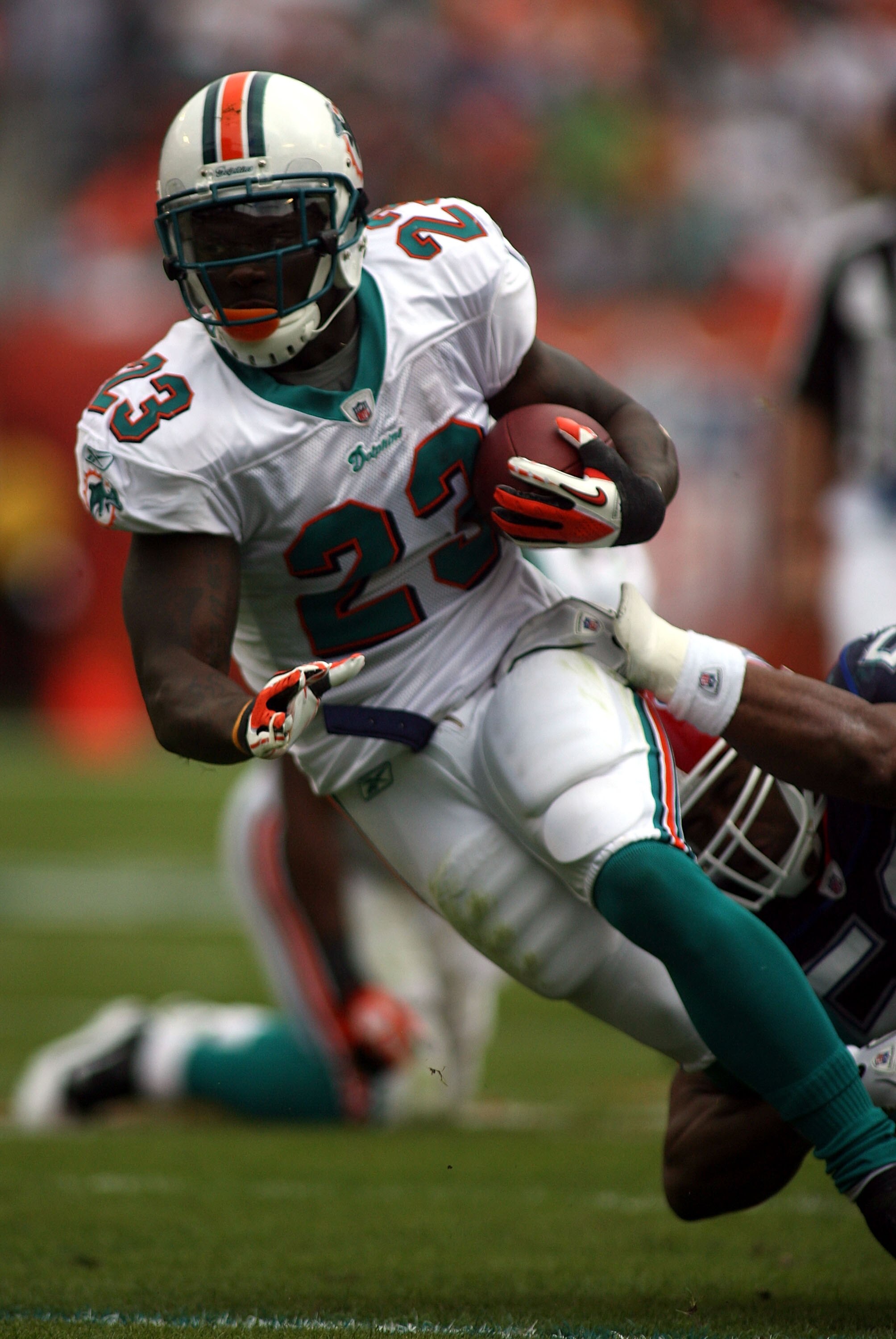 MIAMI - DECEMBER 19:  Running back Ronnie Brown #23 of the Miami Dolphins is upended by the Buffalo Bills at Sun Life Stadium on December 19, 2010 in Miami, Florida.  (Photo by Marc Serota/Getty Images)