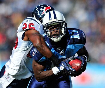 NASHVILLE, TN - DECEMBER 19:  Damian Williams #17 of the Tennessee Titans makes a catch as Eugene Wilson #26 of the Houston Texans defends during the first half at LP Field on December 19, 2010 in Nashville, Tennessee.  (Photo by Grant Halverson/Getty Ima