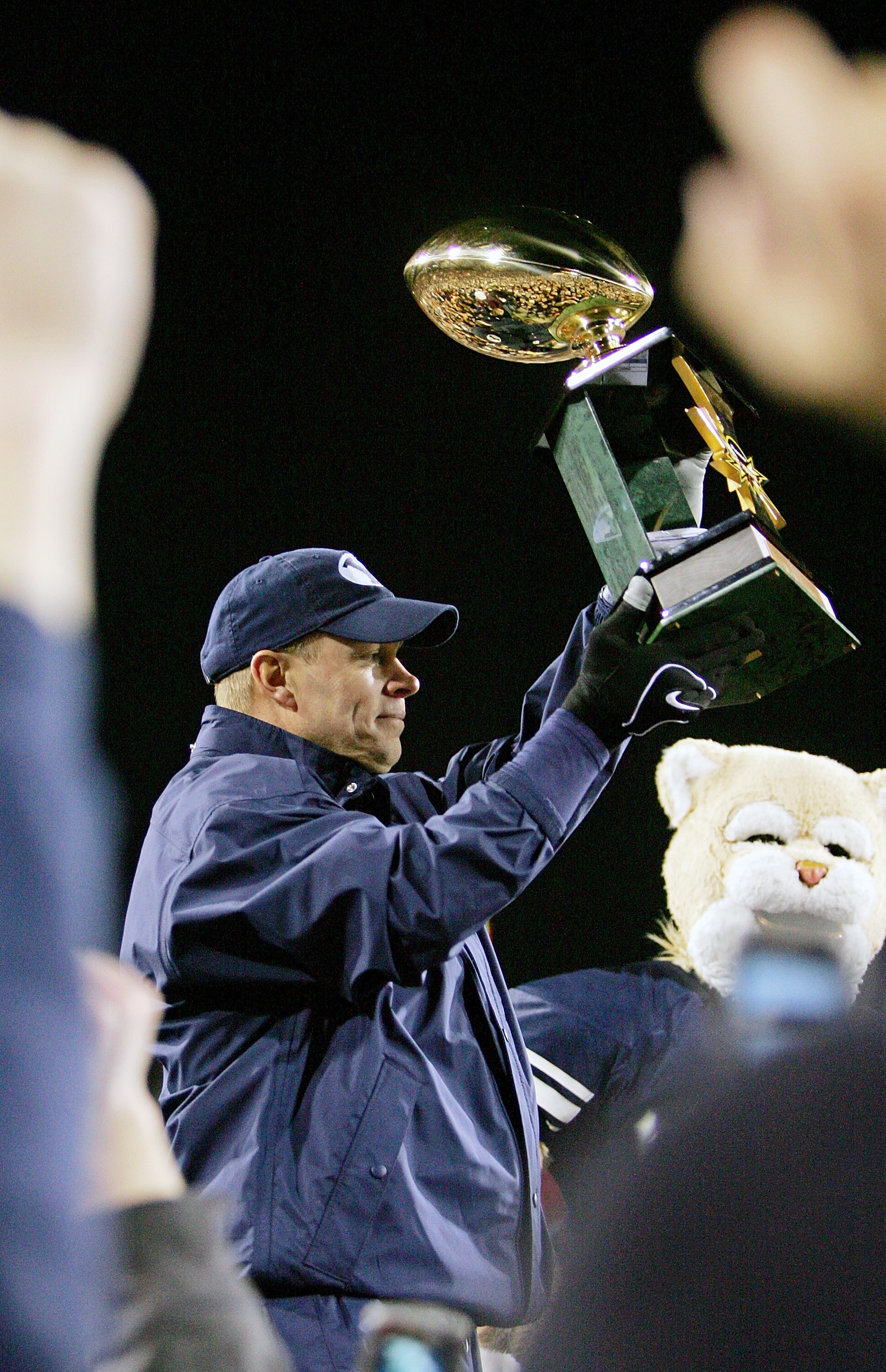 LAS VEGAS - DECEMBER 22:  Brigham Young University Cougars head coach Bronco Mendenhall holds up the game trophy after his team defeated the UCLA Bruins 17-16 in the Pioneer Las Vegas Bowl December 22, 2007 in Las Vegas, Nevada.  (Photo by Ethan Miller/Ge