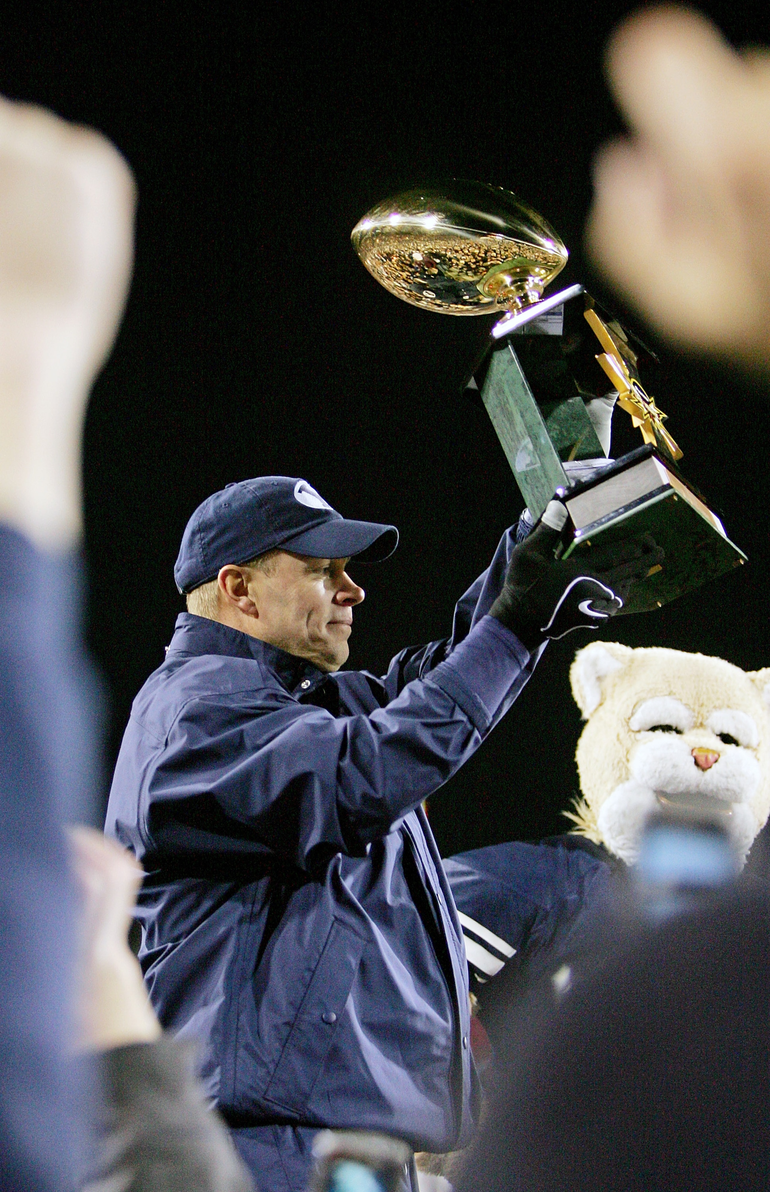 LAS VEGAS - DECEMBER 22:  Brigham Young University Cougars head coach Bronco Mendenhall holds up the game trophy after his team defeated the UCLA Bruins 17-16 in the Pioneer Las Vegas Bowl December 22, 2007 in Las Vegas, Nevada.  (Photo by Ethan Miller/Ge