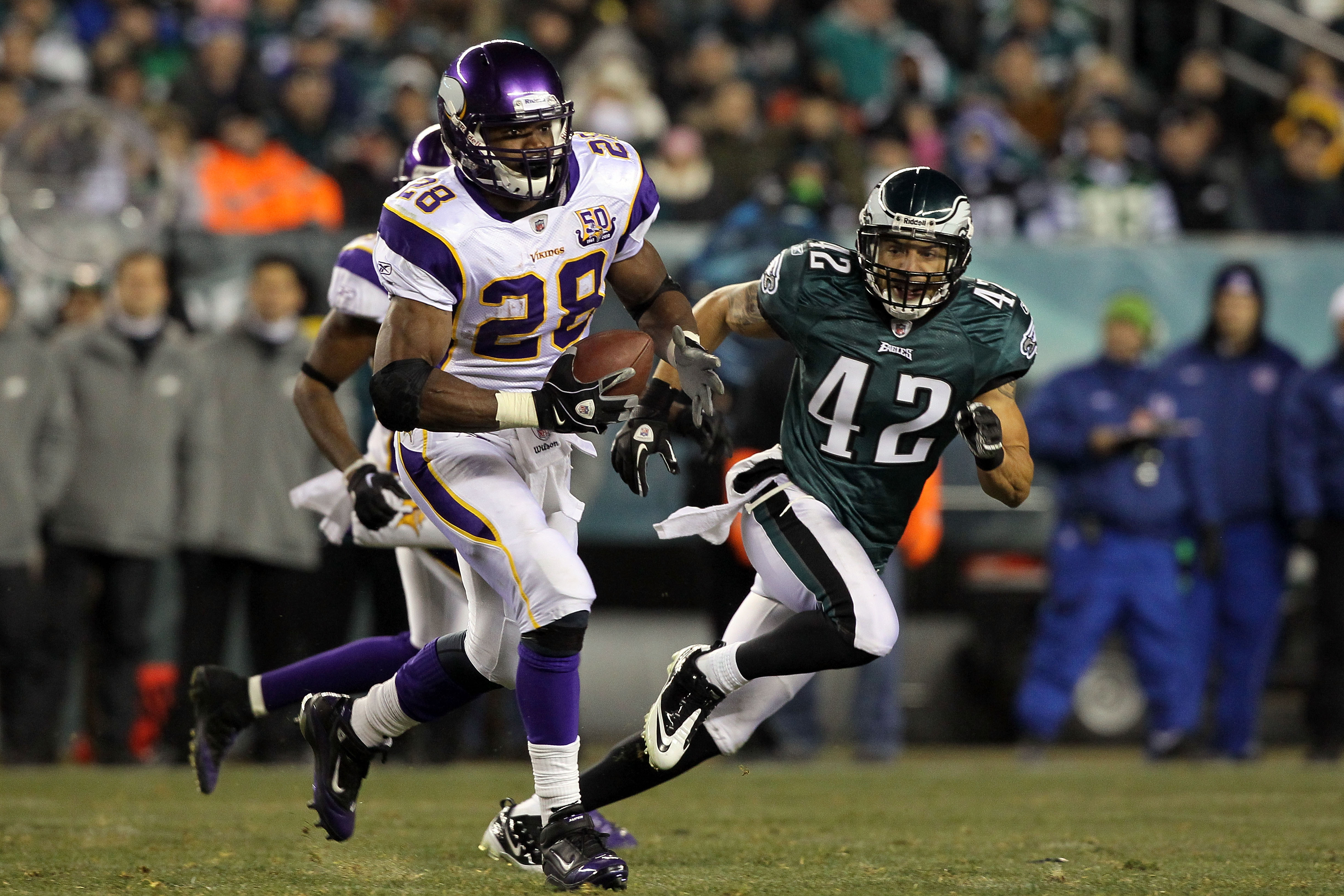 PHILADELPHIA, PA - DECEMBER 28: Adrian Peterson #28 of the Minnesota Vikings runs against Kurt Coleman #42 of the Philadelphia Eagles at Lincoln Financial Field on December 28, 2010 in Philadelphia, Pennsylvania. (Photo by Jim McIsaac/Getty Images)
