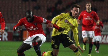 PARIS - NOVEMBER 04:  Mario Gotze (r) of Borussia challenged by Zoumana Camara of PSG during the UEFA Europa League Group J match between Paris Saint Germain and Borussia Dortmund at the Parc des Princes on November 4, 2010 in Paris, France.  (Photo by Mi