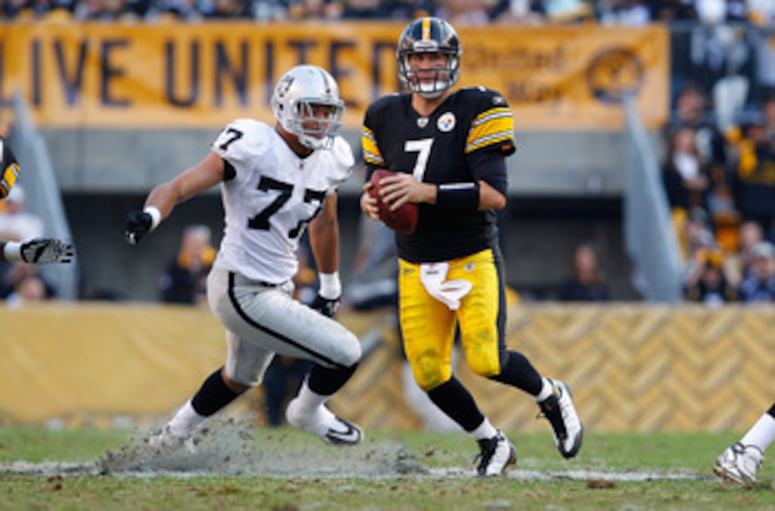 PITTSBURGH, PA - NOVEMBER 21:  Ben Roethlisberger #7 of the Pittsburgh Steelers runs out of the pocket from Matt Shaughnessy #77 of the Oakland Raiders during the game on November 21, 2010 at Heinz Field in Pittsburgh, Pennsylvania.  (Photo by Jared Wicke