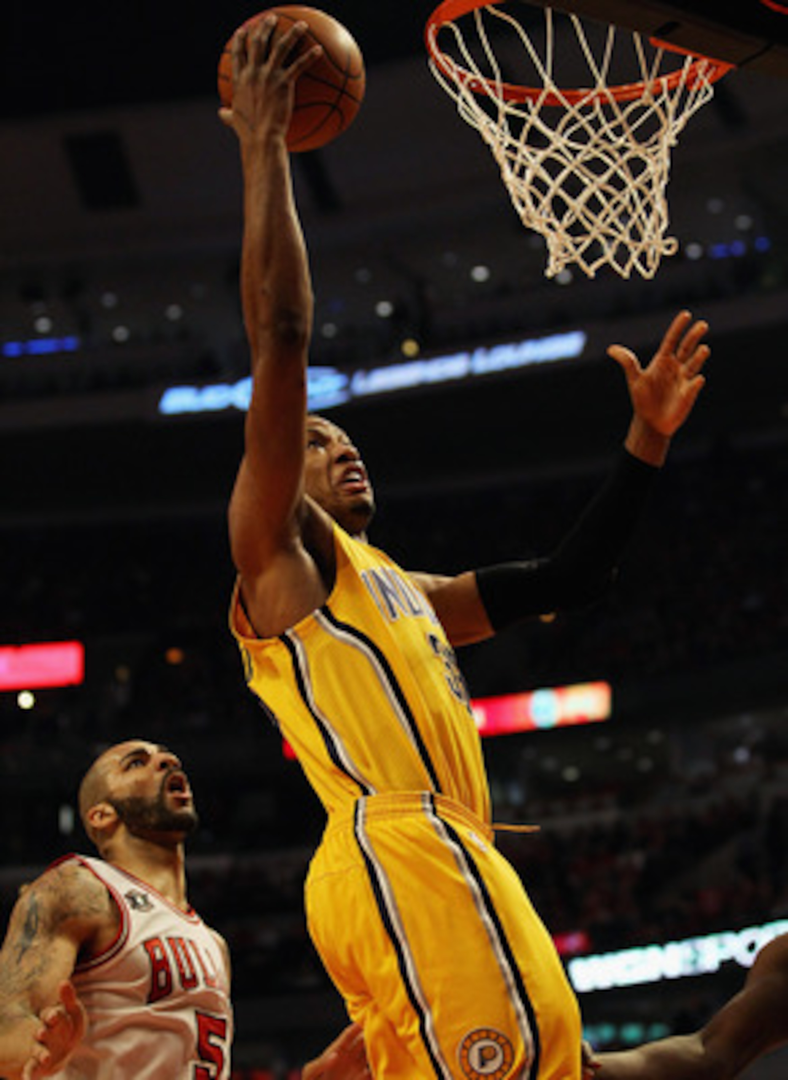 CHICAGO, IL - APRIL 26: Danny Granger #33 of the Indiana Pacers drives to the basket past Carlos Boozer #5 of the Chicago Bulls in Game Five of the Eastern Conference Quarterfinals in the 2011 NBA Playoffs at the United Center on April 26, 2011 in Chicago