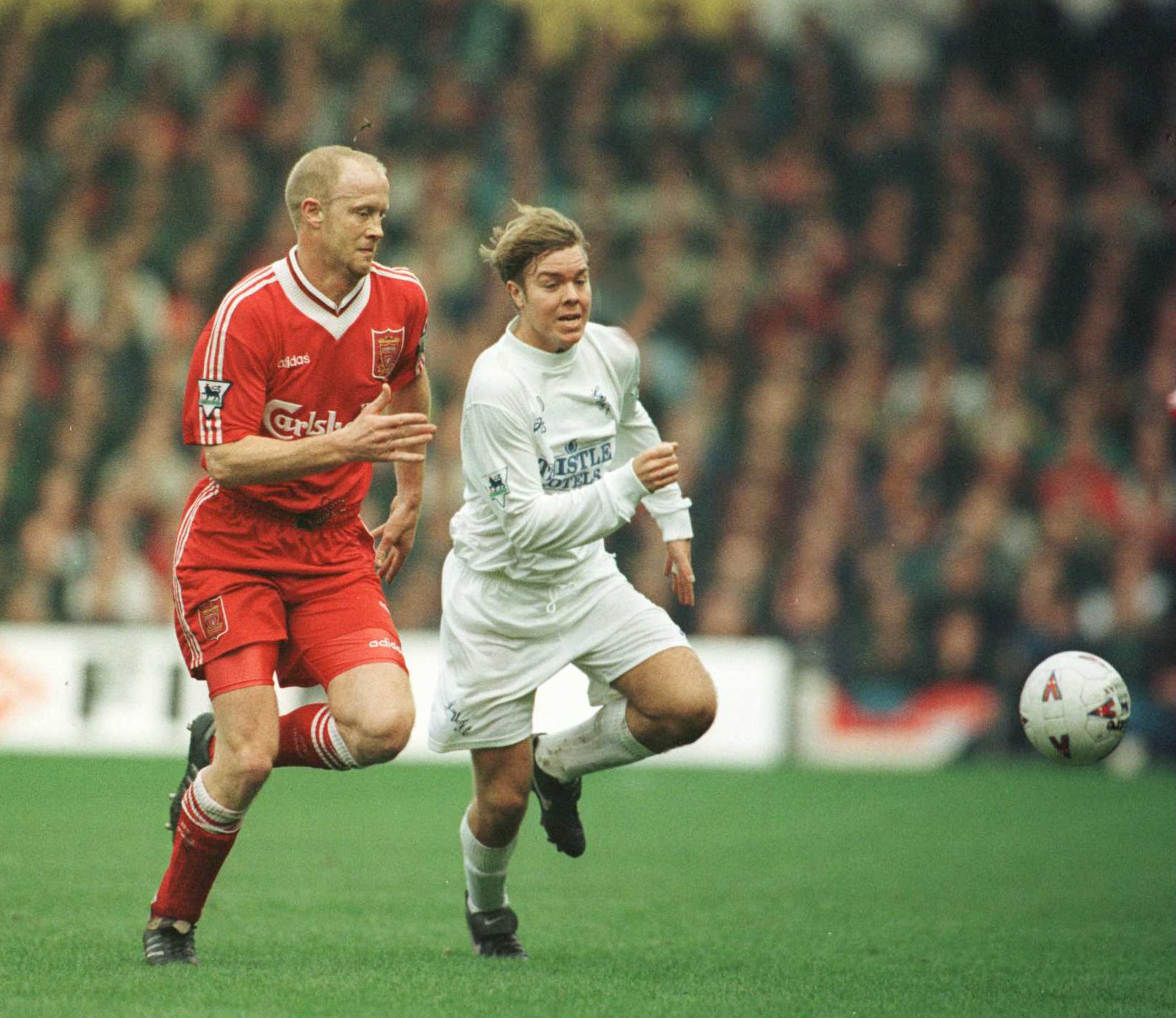 10 Mar 1996:  Mark Wright of Liverpool battle with Tomas Brolin of Leeds during the Leeds United v Liverpool FA Cup Quarter Final match at Elland Road, Leeds. Mandatory Credit: Clive Brunskill/ALLSPORT