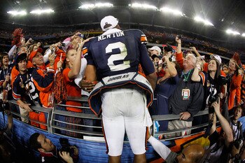 GLENDALE, AZ - JANUARY 10:  Quarterback Cameron Newton #2 of the Auburn Tigers celebrates the Tigers 22-19 victory with the fans after defeating the Oregon Ducks in the Tostitos BCS National Championship Game at University of Phoenix Stadium on January 10