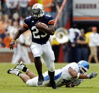 AUBURN, AL - OCTOBER 23:  Ronnie Brown #23 of Auburn Tigers avoids a tackle by Lamar Mills #45 of Kentucky Wildcats on October 23, 2004 at Jordan-Hare stadium in Auburn, Alabama. Auburn defeated Kentucky 41-10. (Photo by Chris Graythen/Getty Images)
