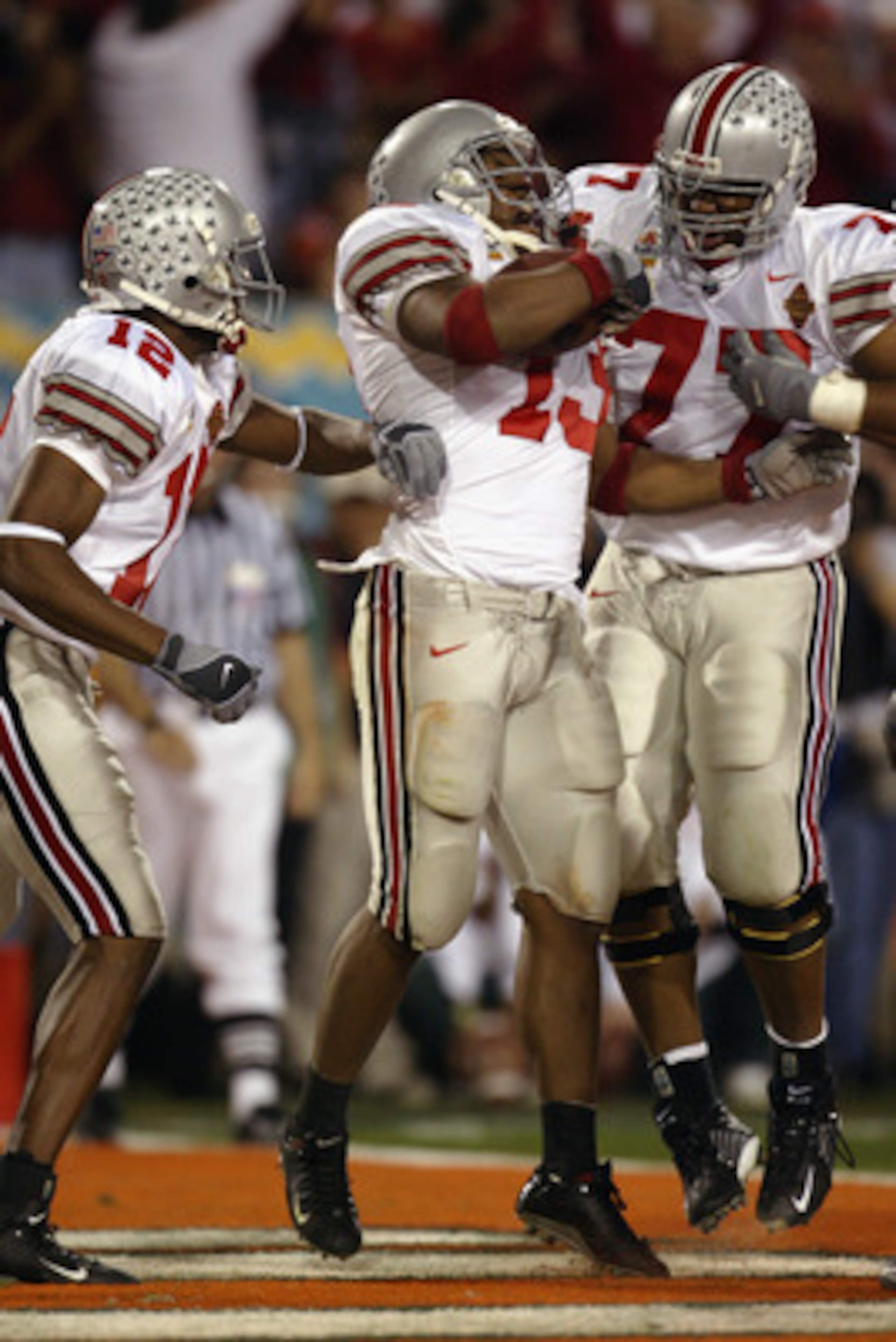 TEMPE, AZ - JANUARY 3:  Running back Maurice Clarett #13 of the Ohio State Buckeyes celebrates after scoring the team's second touchdown against the University of Miami Hurricanes during the Tostitos Fiesta Bowl at Sun Devil Stadium on January 3, 2003 in