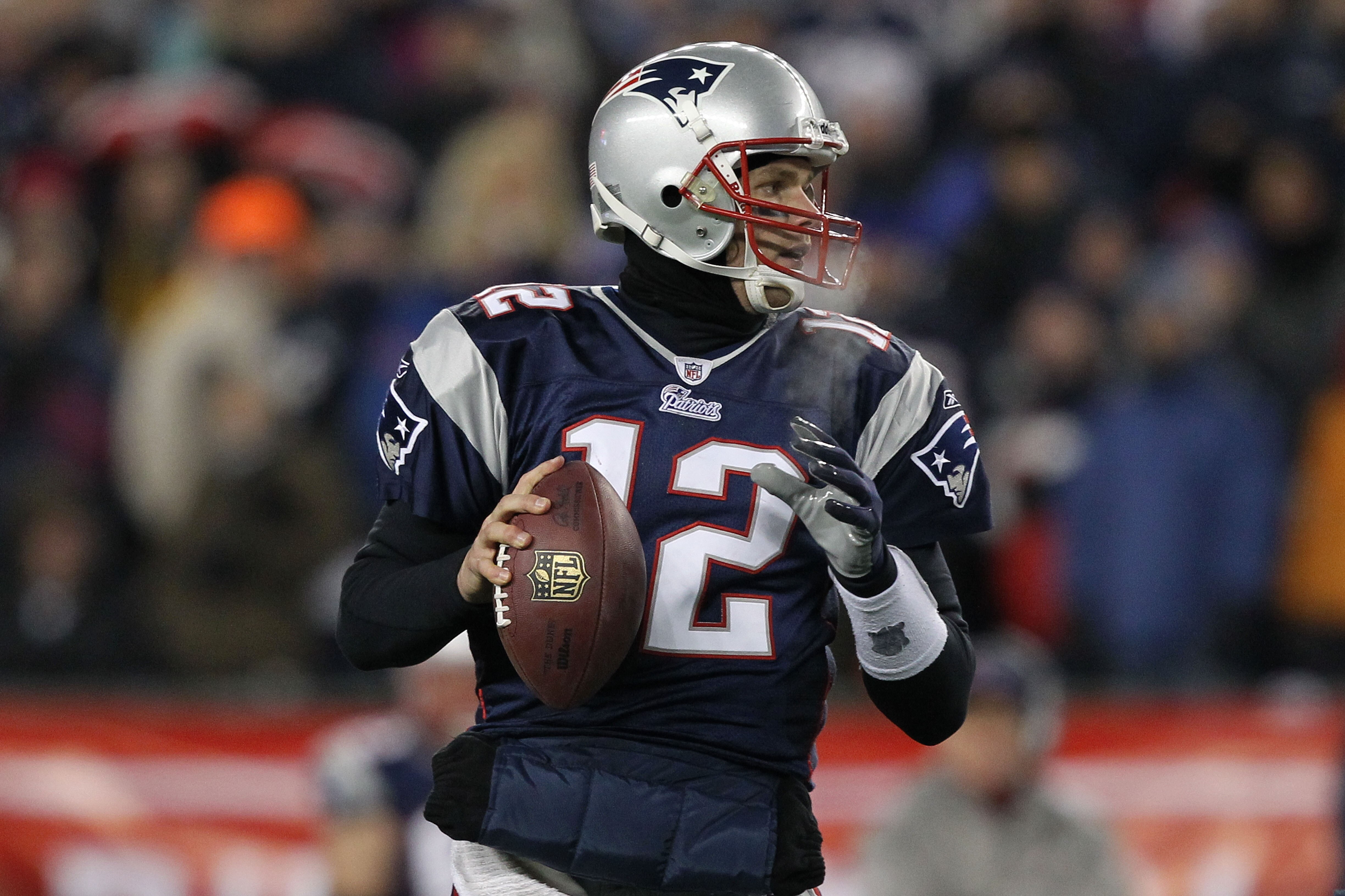 FOXBORO, MA - JANUARY 16:  Quarterback Tom Brady #12 of the New England Patriots looks to pass during their 2011 AFC divisional playoff game against the New York Jets at Gillette Stadium on January 16, 2011 in Foxboro, Massachusetts.  (Photo by Al Bello/G
