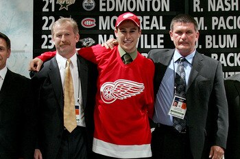 COLUMBUS, OH - JUNE 22: 27th overall pick Brendan Smith of the Detroit Red Wings poses with team personal after being drafted in the first round of the 2007 NHL Entry Draft at Nationwide Arena on June 22, 2007 in Columbus, Ohio. (Photo by Bruce Bennett/ COLUMBUS, OH - JUNE 22: 27th overall pick Brendan Smith of the Detroit Red Wings poses with team personal after being drafted in the first round of the 2007 NHL Entry Draft at Nationwide Arena on June 22, 2007 in Columbus, Ohio. (Photo by Bruce Bennett/