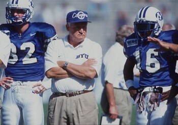28 Sep 1996:  Head coach Lavell Edwards  of  Brigham Young University stands between his players Ronney Jenkins and Jared Kennedy during their 31-3 win over Southern Methodist University at Cougar Stadium in Provo, Utah. Mandatory Credit: Andy Lyons/Allsp