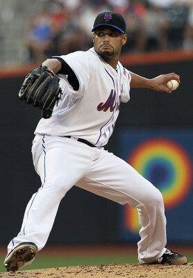 NEW YORK - JULY 06:  Johan Santana #57 of the New York Mets delivers a pitch against the Cincinnati Reds on July 6, 2010 at Citi Field in the Flushing neighborhood of the Queens borough of New York City.  (Photo by Jim McIsaac/Getty Images)