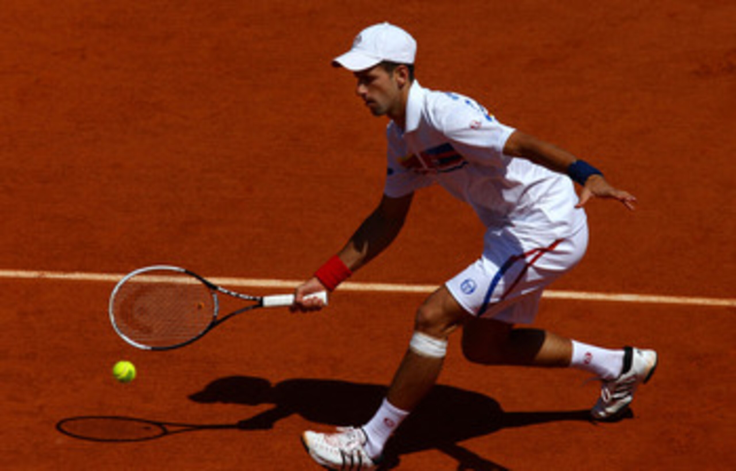 PARIS, FRANCE - MAY 23:  Novak Djokovic of Serbia hits a forehand during the men's singles first round match between Thiemo De Bakker of Netherlands and Novak Djokovic of Serbia on day two of the French Open at Roland Garros on May 23, 2011 in Paris, Fran