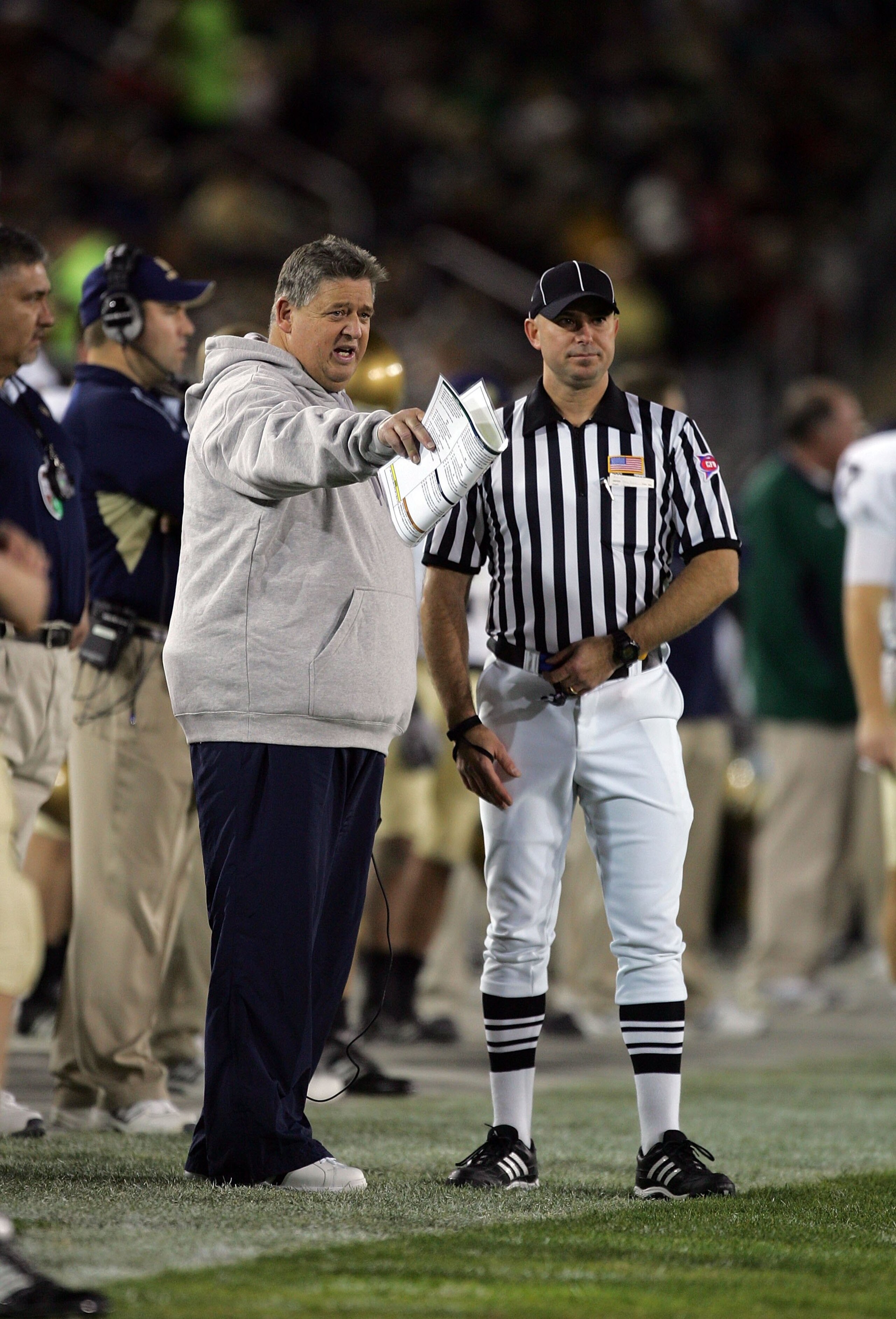 PALO ALTO, CA - NOVEMBER 28:  Notre Dame head coach Charlie Weis speaks to a referee during their game against the Stanford Cardinal at Stanford Stadium on November 28, 2009 in Palo Alto, California.  (Photo by Ezra Shaw/Getty Images)