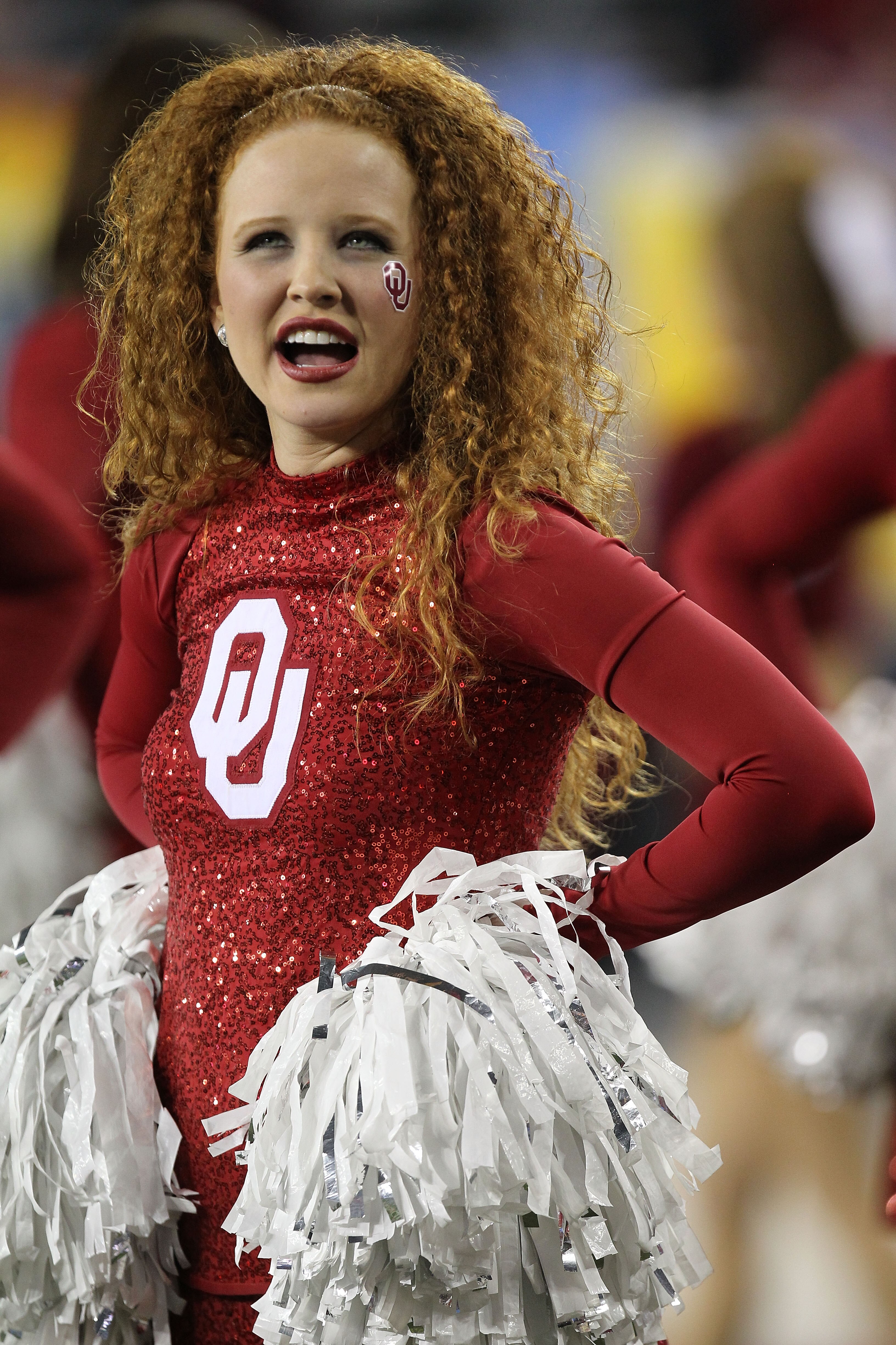 GLENDALE, AZ - JANUARY 01:  An Oklahoma Sooners cheerleader looks on as the football team takes on Connecticut Huskies during the Tostitos Fiesta Bowl at the Universtity of Phoenix Stadium on January 1, 2011 in Glendale, Arizona.  (Photo by Ronald Martine