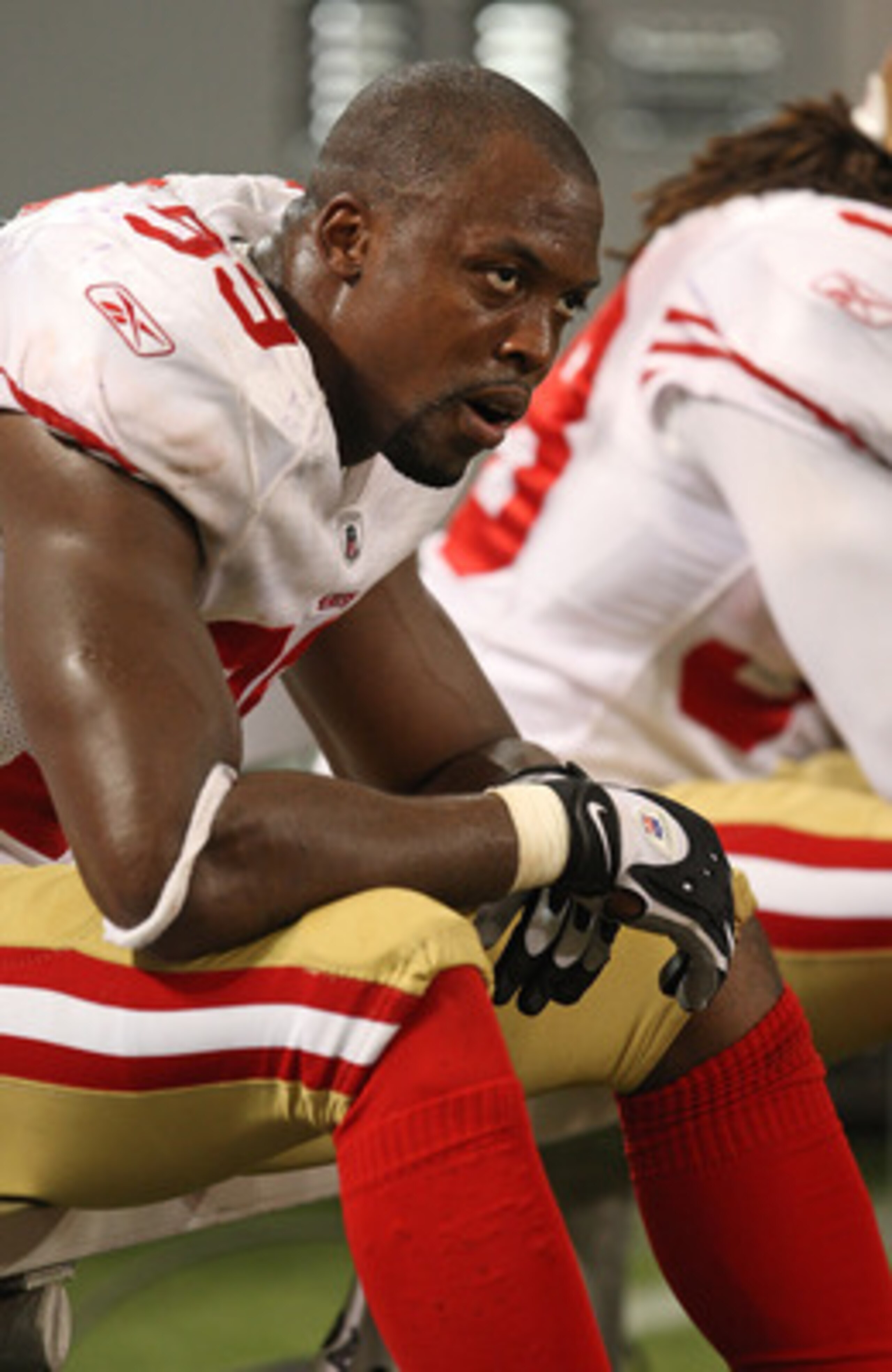 MINNEAPOLIS - SEPTEMBER 27: Manny Lawson #99 of the San Francisco 49ers sits on the bench at the end of a game against the Minnesota Vikings at the Hubert H. Humphrey Metrodome on September 27, 2009 in Minneapolis, Minnesota. The Vikings defeated the 49er