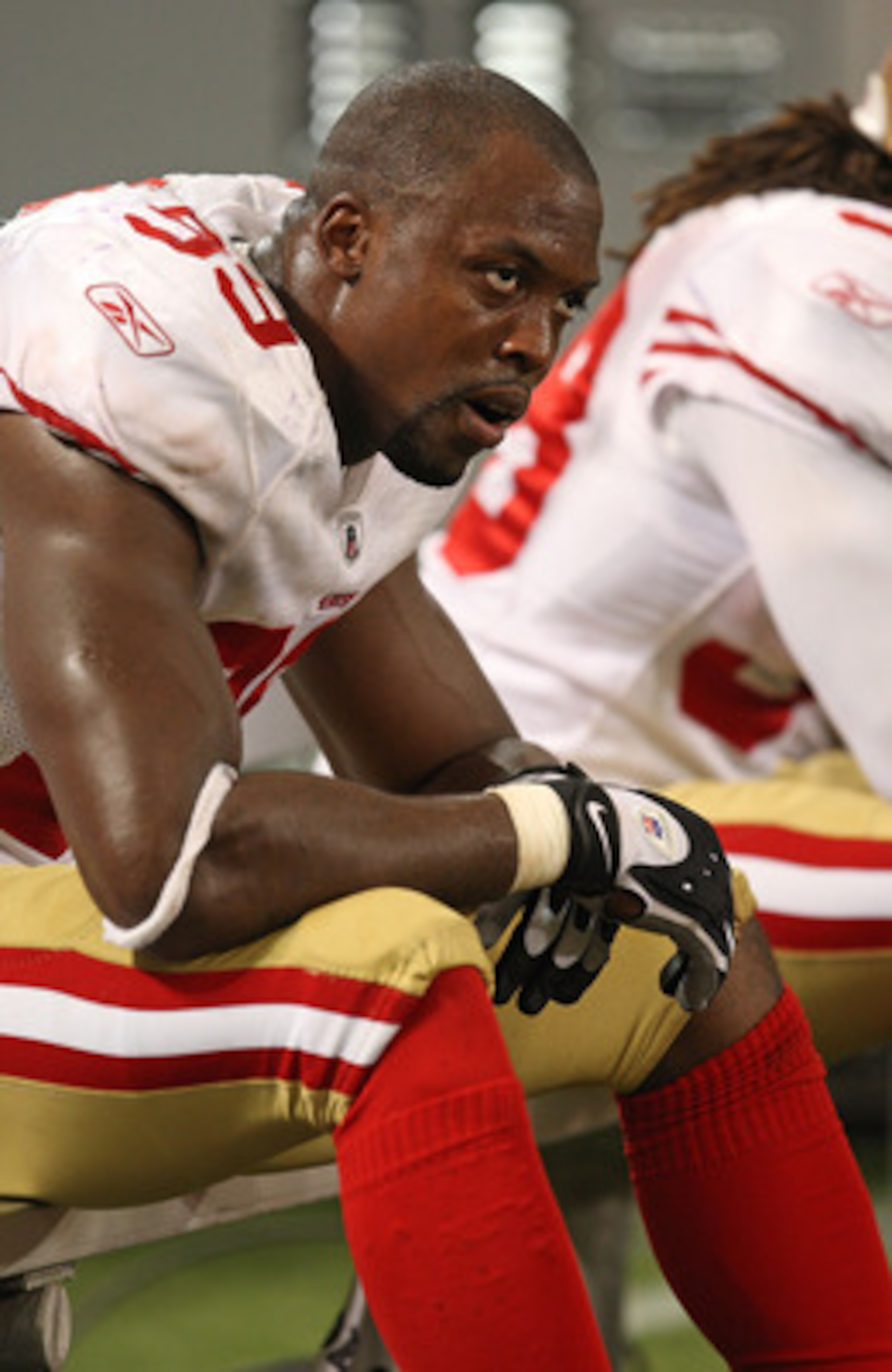 MINNEAPOLIS - SEPTEMBER 27: Manny Lawson #99 of the San Francisco 49ers sits on the bench at the end of a game against the Minnesota Vikings at the Hubert H. Humphrey Metrodome on September 27, 2009 in Minneapolis, Minnesota. The Vikings defeated the 49er