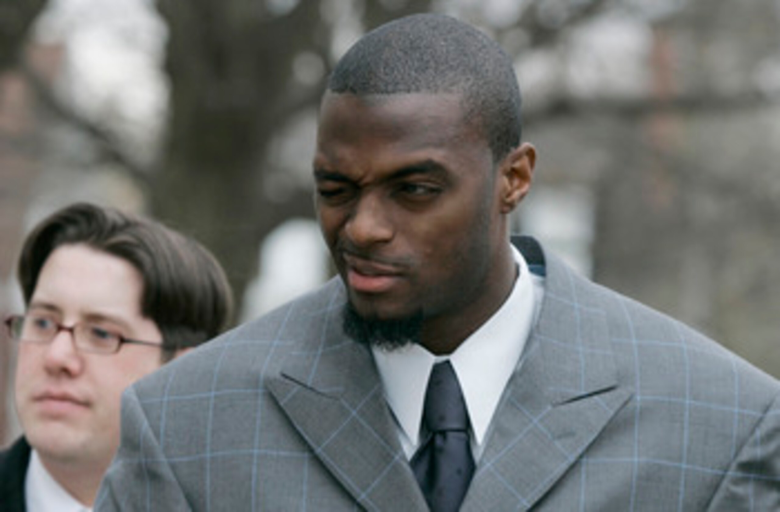 LEBANON - JANUARY 14: New York Giants wide receiver Plaxico Burress winks at a supporter as he arrives at the Lebanon County Courthouse January 14, 2009 in Lebanon, Pa.  Burress is scheduled to appear in a civil trial in a dispute with an automobile deale