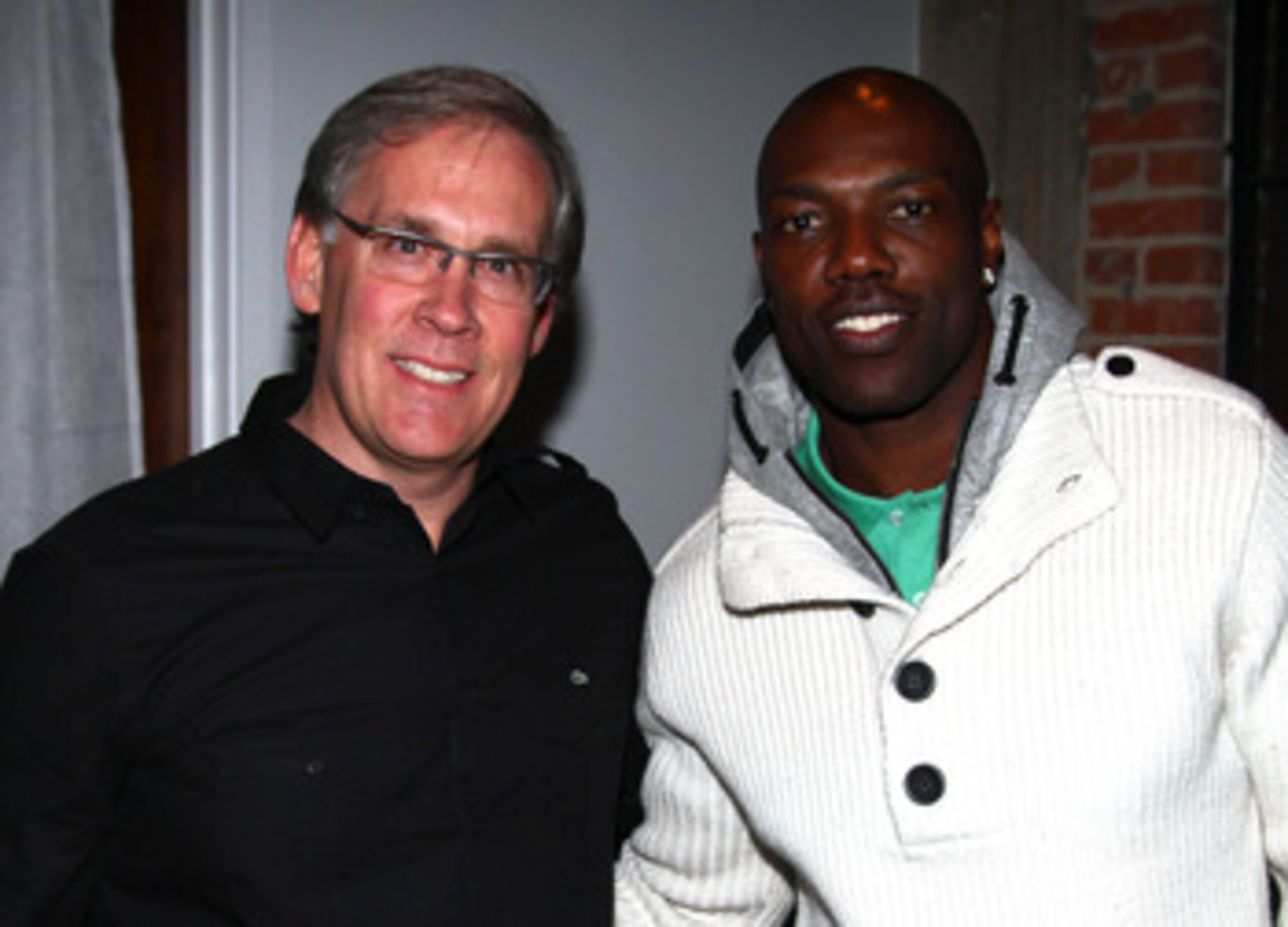 DALLAS, TX - FEBRUARY 04:  Steve Birkhold of Lacoste (L) and NFL player Terrell Owens attend GQ, Cadillac, Lacoste and Patron Tequila Celebrating the Coolest Athletes and the Big Game hosted by Andy Roddick at Hickory Street Annex on February 4, 2011 in D