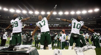 FOXBORO, MA - JANUARY 16:  Jerricho Cotchery #89, Braylon Edwards #17 and Santonio Holmes #10 of the New York Jets celebrate their 28 to 21 victory over the New England Patriots during their 2011 AFC divisional playoff game at Gillette Stadium on January 