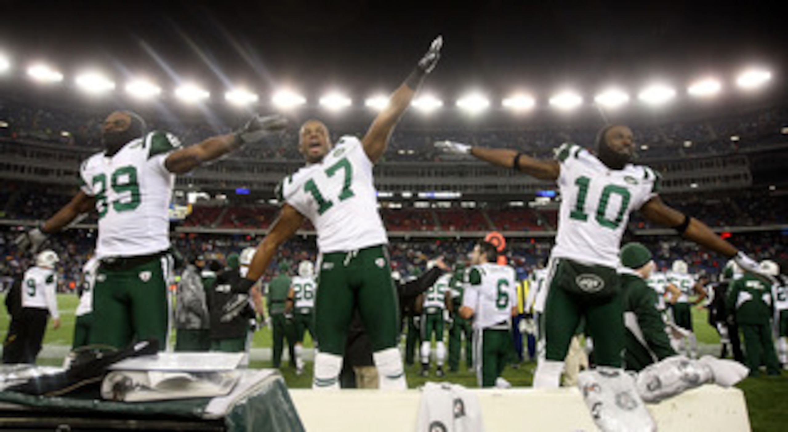 FOXBORO, MA - JANUARY 16:  Jerricho Cotchery #89, Braylon Edwards #17 and Santonio Holmes #10 of the New York Jets celebrate their 28 to 21 victory over the New England Patriots during their 2011 AFC divisional playoff game at Gillette Stadium on January 