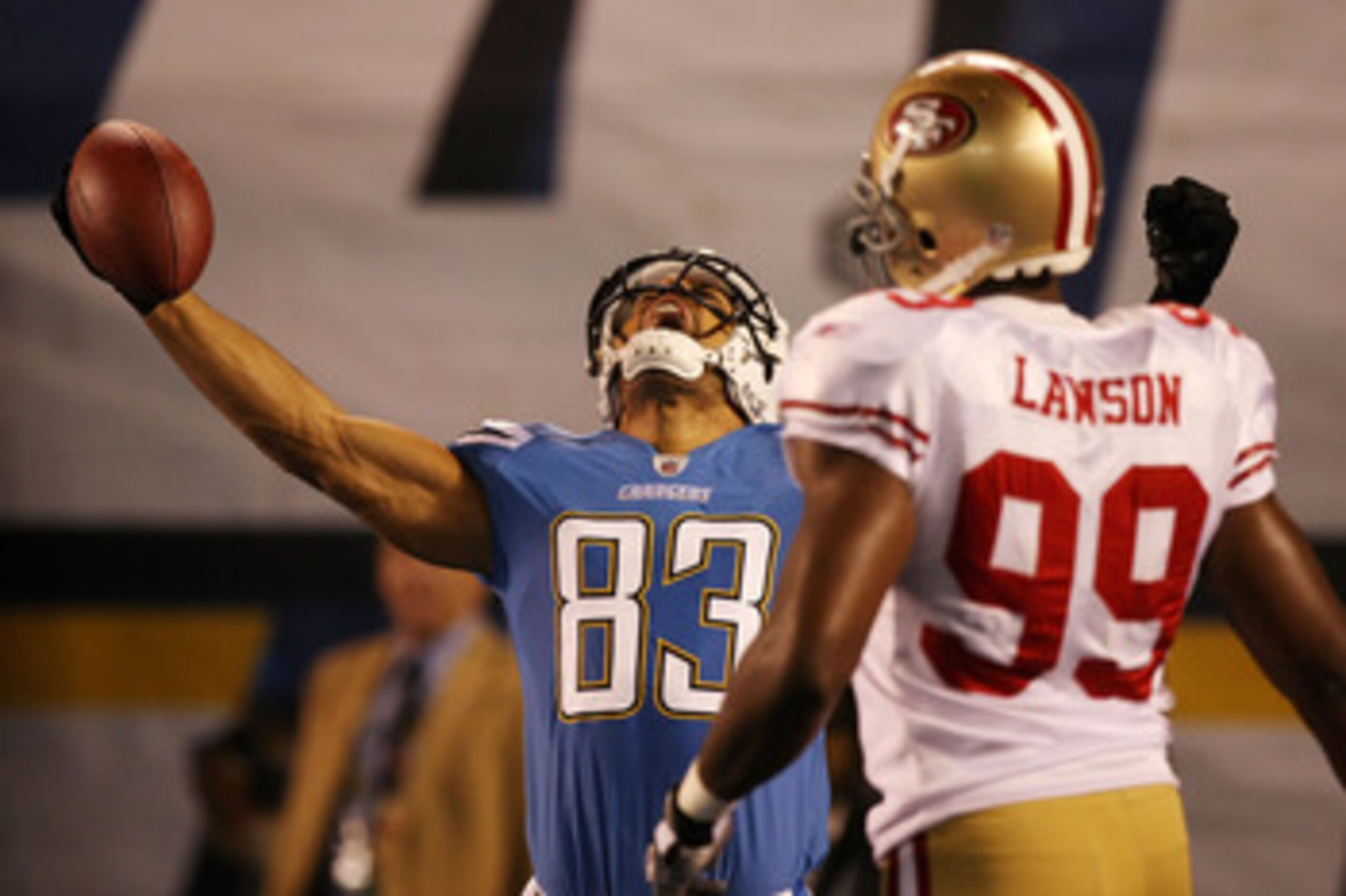 SAN DIEGO, CA - DECEMBER 16:  Wide receiver Vincent Jackson #83 of the San Diego Chargers celebrates scoring a touchdown in the first quarter in front of linebacker Manny Lawson #99 of the San Francisco 49ers at Qualcomm Stadium on December 16, 2010 in Sa