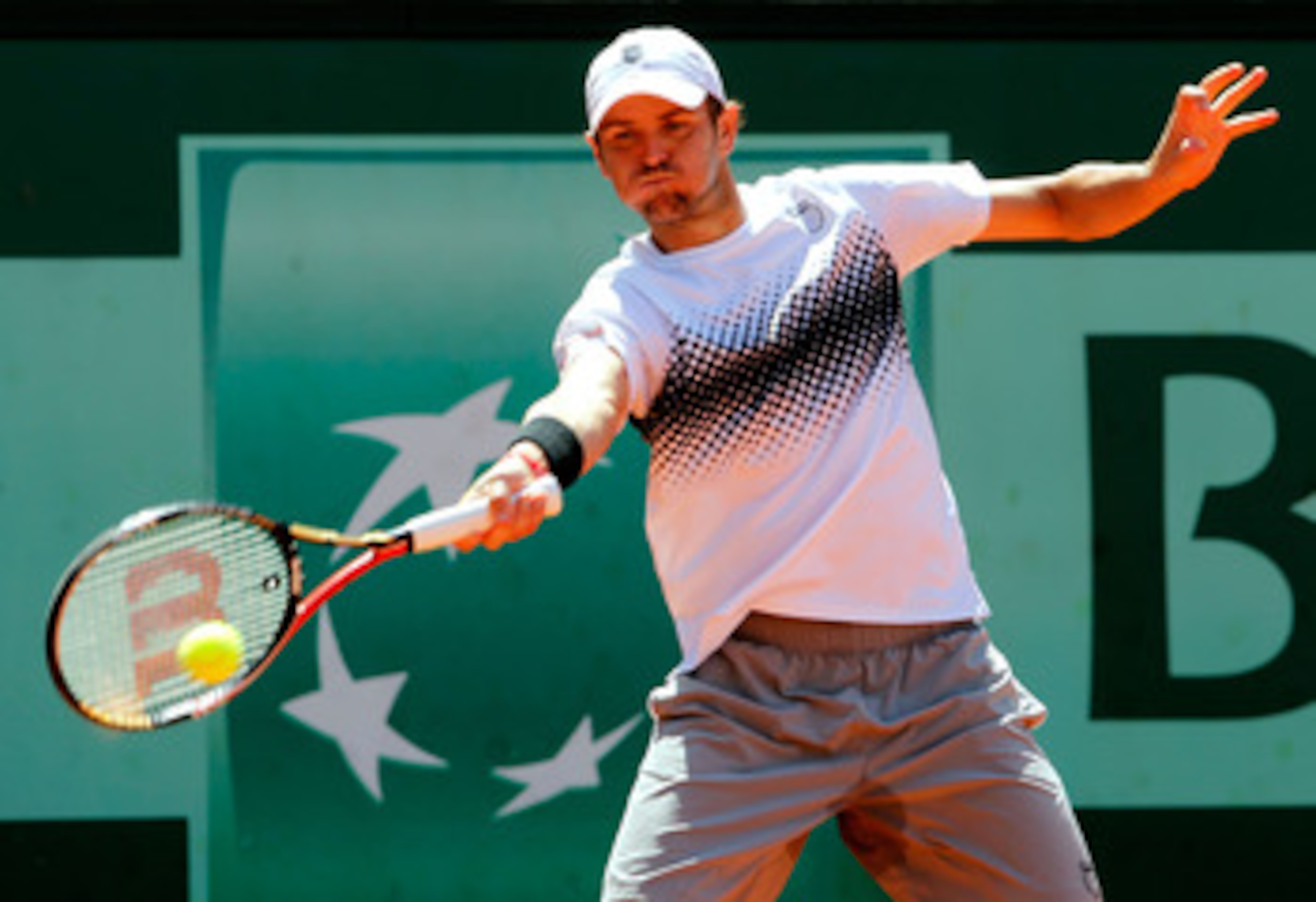 PARIS, FRANCE - MAY 23:  Mardy Fish of USA plays a forehand during the men's singles first round match between Mardy Fish of USA and Ricardo Mello of Brazil on day two of the French Open at Roland Garros on May 23, 2011 in Paris, France.  (Photo by Matthe