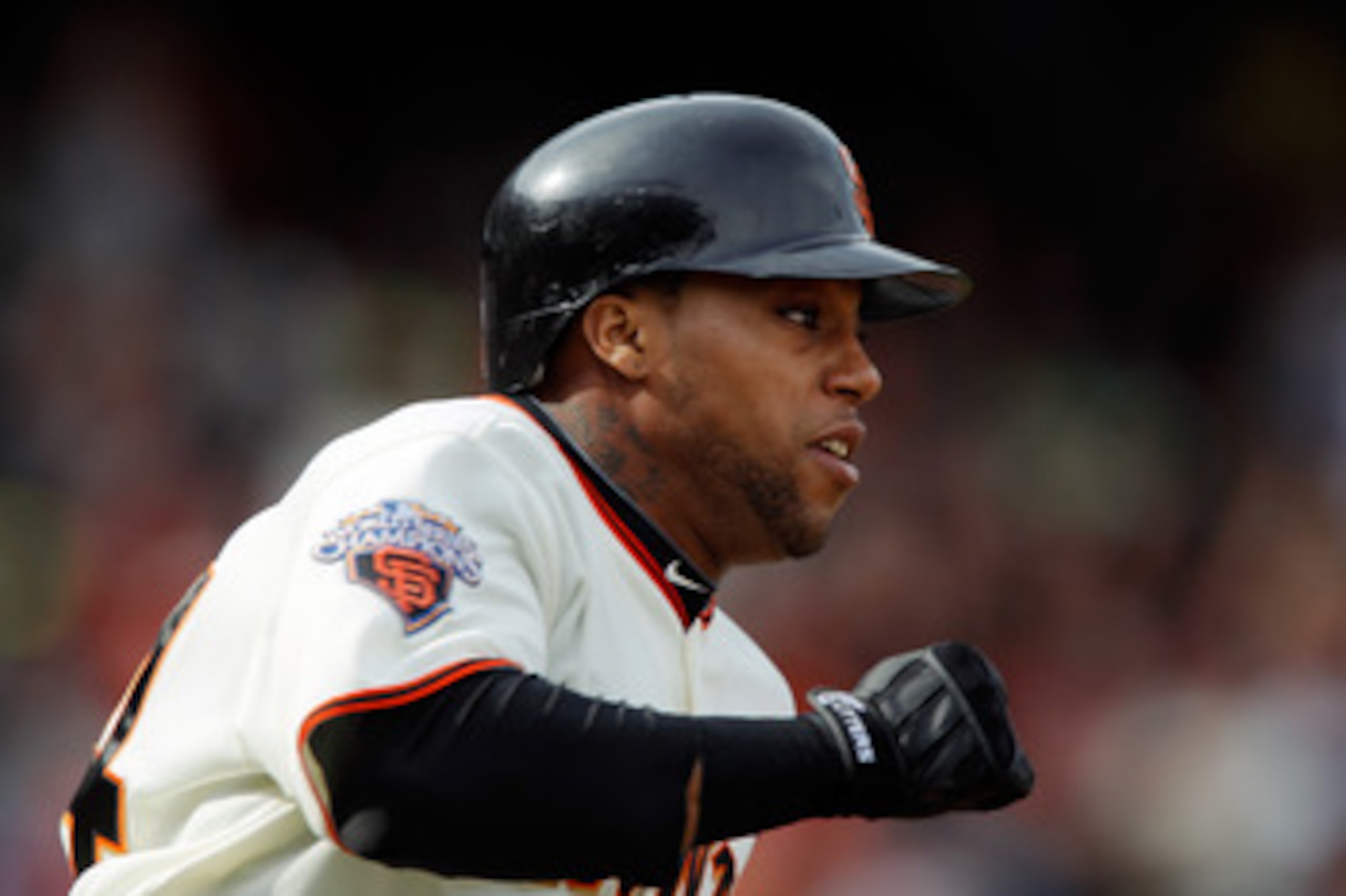 SAN FRANCISCO, CA - MAY 22: Darren Ford #34 of the San Francisco Giants rounds first base on a single against the Oakland A's in the 11th inning at AT&T Park on May 22, 2011 in San Francisco, California. Ford stole second and scored the winning run in the