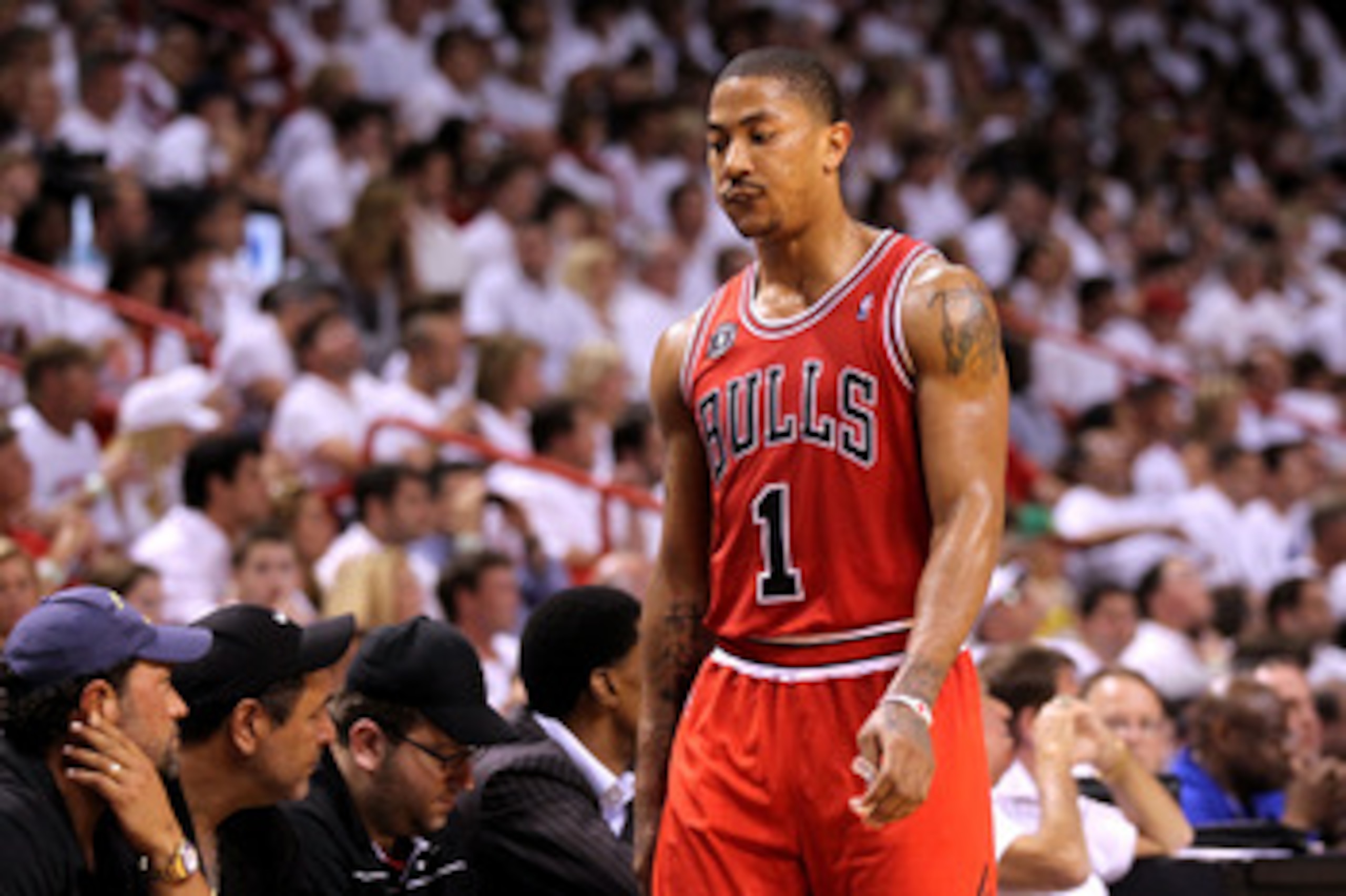 MIAMI, FL - MAY 22:  Derrick Rose #1 of the Chicago Bulls walks back to the bench against the Miami Heat in Game Three of the Eastern Conference Finals during the 2011 NBA Playoffs on May 22, 2011 at American Airlines Arena in Miami, Florida.  NOTE TO USE