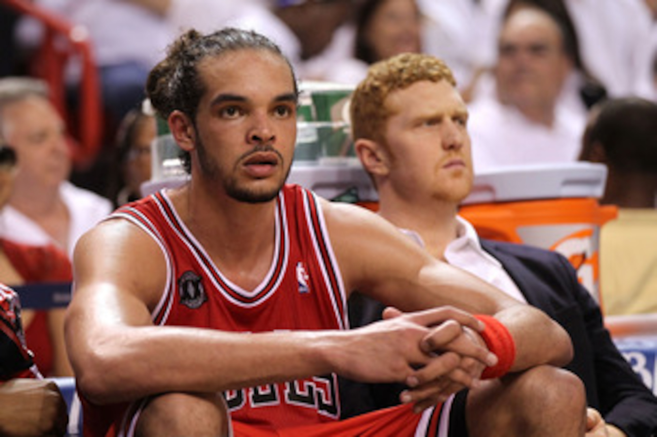 MIAMI, FL - MAY 22:  Joakim Noah #13 (L) and Brian Scalabrine #24 of the Chicago Bulls look on dejected from the bench late in the fourth quarter against the Miami Heat in Game Three of the Eastern Conference Finals during the 2011 NBA Playoffs on May 22,