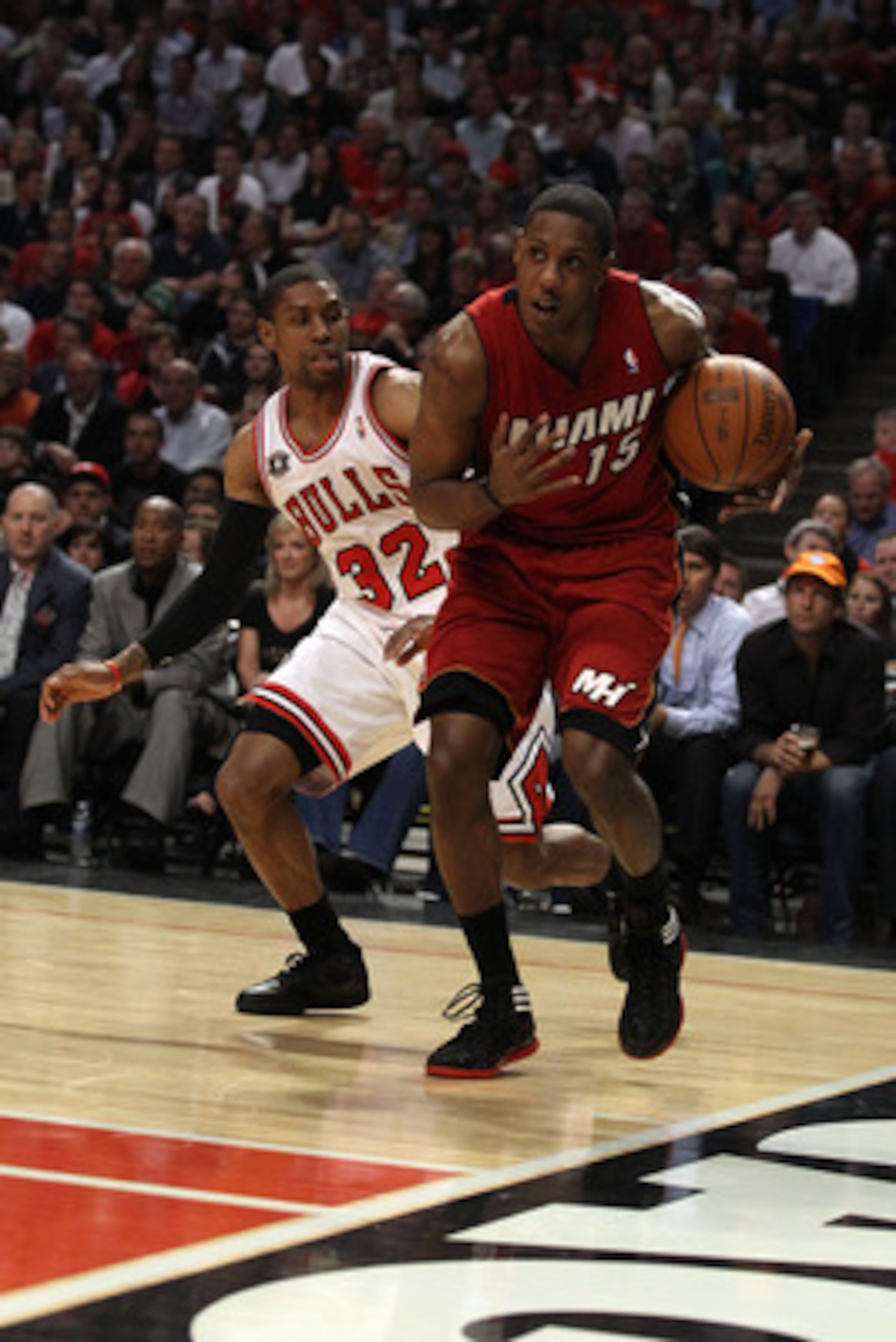 CHICAGO, IL - MAY 18: Mario Chalmers #15 of the Miami Heat drives past C.J. Watson #32 of the Chicago Bulls in Game Two of the Eastern Conference Finals during the 2011 NBA Playoffs on May 18, 2011 at the United Center in Chicago, Illinois. The Heat won 8