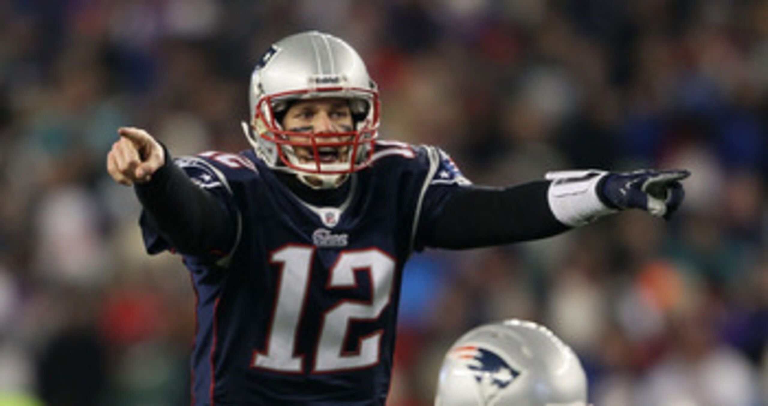 FOXBORO, MA - JANUARY 16:  Quarterback Tom Brady #12 of the New England Patriots signals during their 2011 AFC divisional playoff game against the New York Jets at Gillette Stadium on January 16, 2011 in Foxboro, Massachusetts.  (Photo by Elsa/Getty Image