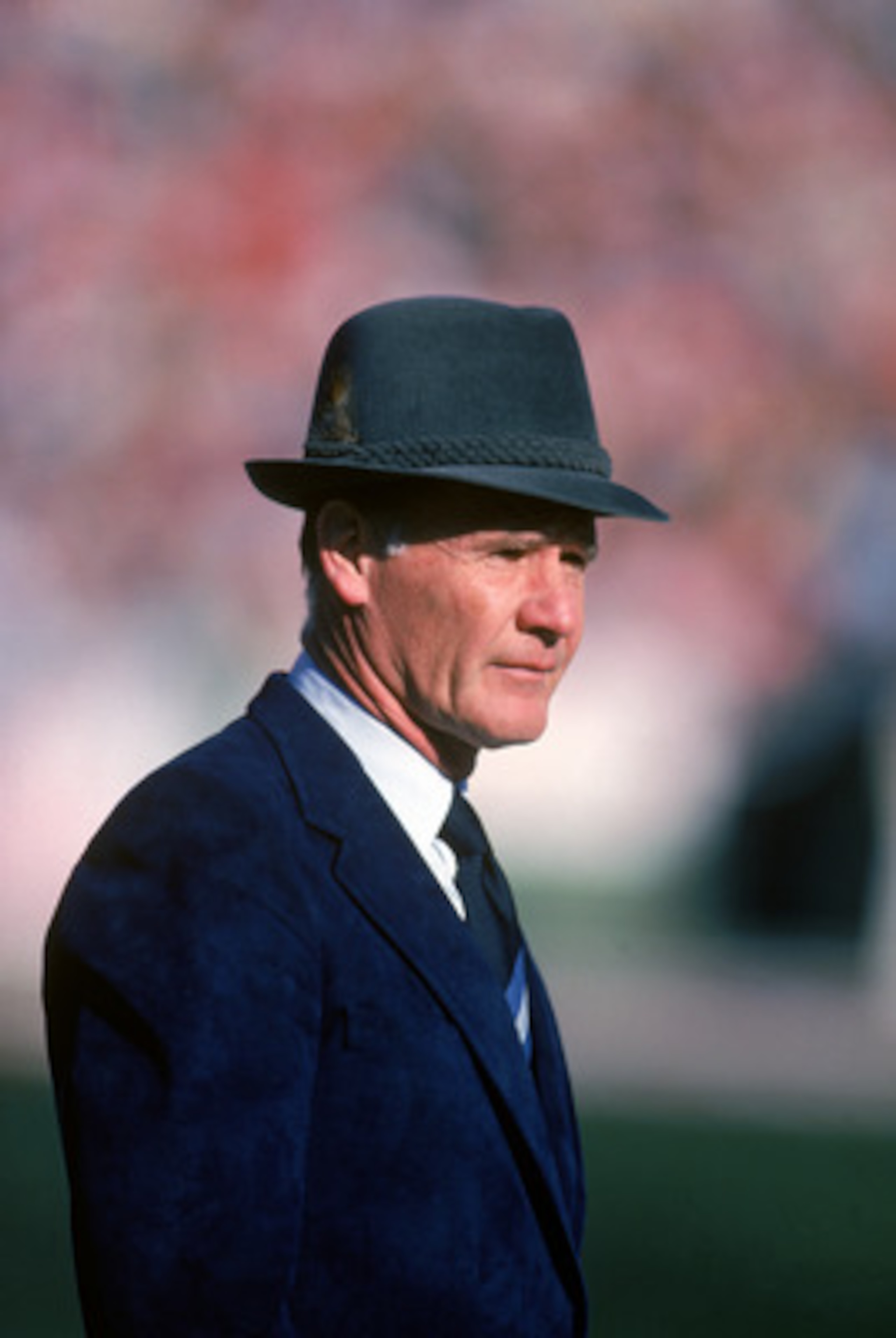1983:  Head coach Tom Landry of the Dallas Cowboys watches from the sideline during a game in the 1988 season.  Tom Landry coached the Cowboys from 1960 to 1988, leading them to two Super Bowl victories.  (Photo by Getty Images)