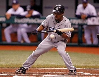 ST. PETERSBURG - SEPTEMBER 24:  Infielder Chone Figgins #9 of the Seattle Mariners attempts a bunt against the Tampa Bay Rays during the game at Tropicana Field on September 24, 2010 in St. Petersburg, Florida.  (Photo by J. Meric/Getty Images)