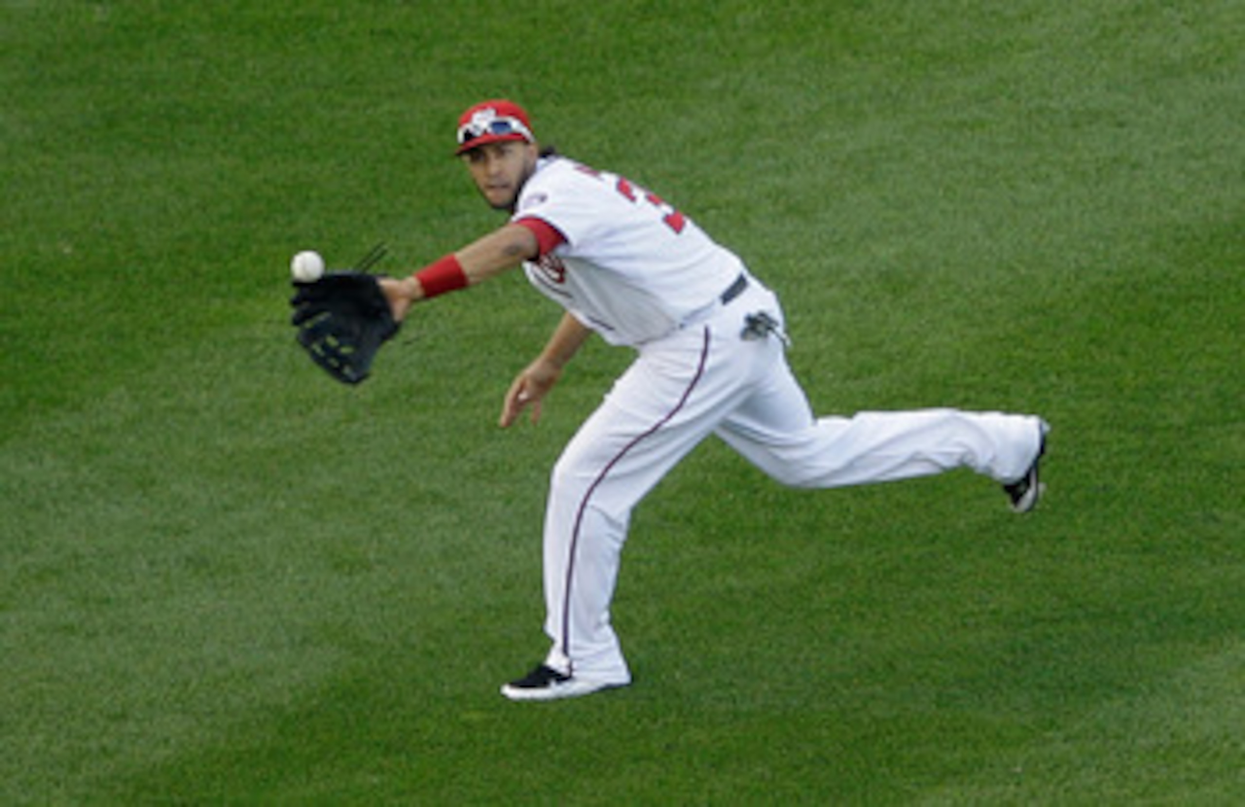 WASHINGTON, DC - APRIL 17:  Left fielder Michael Morse #38 of the Washington Nationals catches a ball for an out hit a by Ryan Braun #8 of the Milwaukee Brewers in the fourth inning during the second game of a doubleheader at Nationals Park on April 17, 2