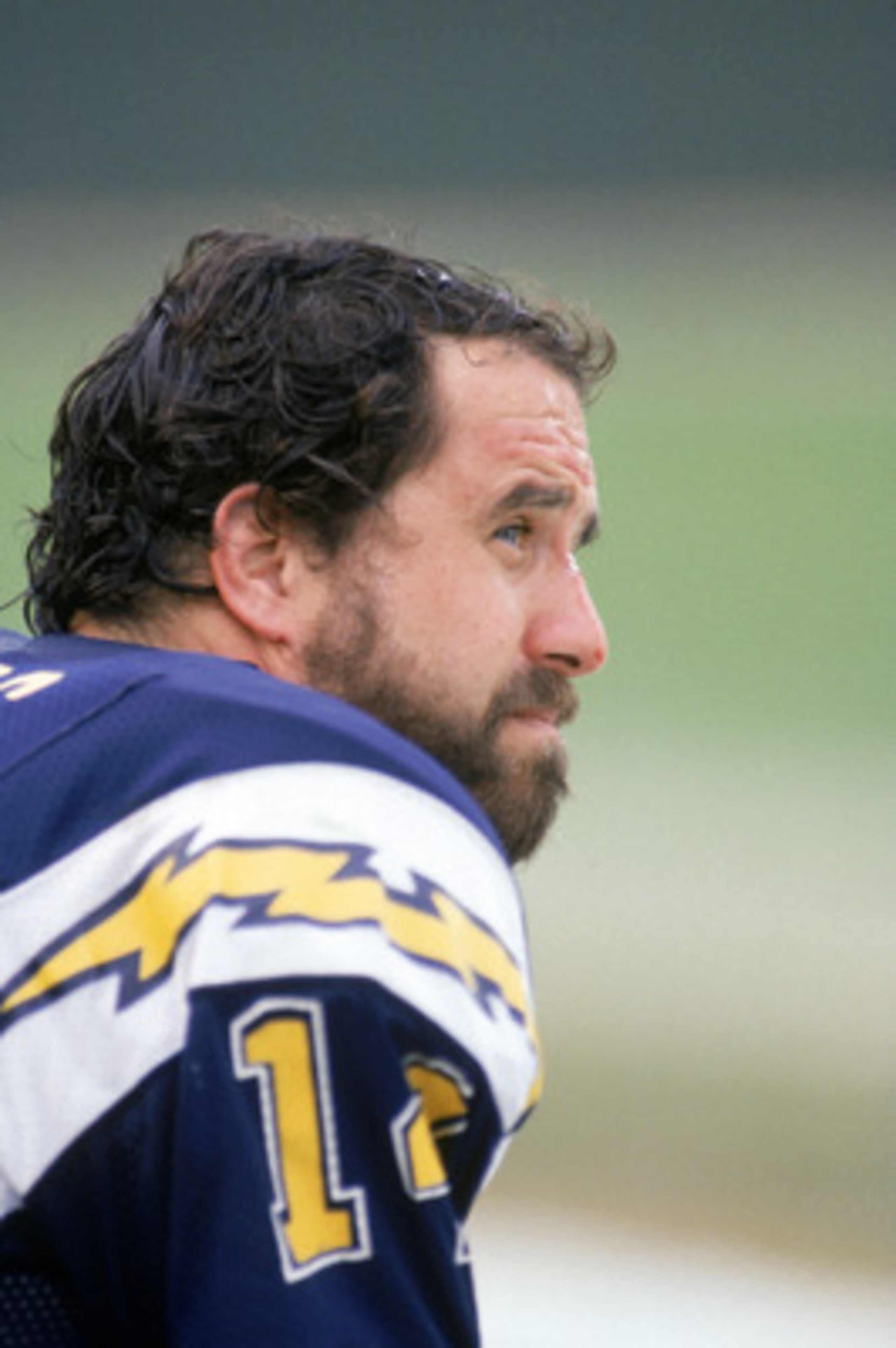 SAN DIEGO - NOVEMBER 10:  Quarterback Dan Fouts #14 of the San Diego Chargers watches the action from the sidelines during a game against the Los Angeles Raiders at Jack Murphy Stadium on November 10, 1985 in San Diego, California.  The Chargers won 40-34
