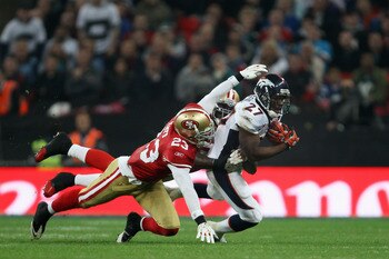 LONDON, ENGLAND - OCTOBER 31:  Knowshon Moreno #27 of Denver Broncos is tackled by Taylor Mays #23 of San Francisco 49ers during the NFL International Series match between Denver Broncos and San Francisco 49ers at Wembley Stadium on October 31, 2010 in Lo