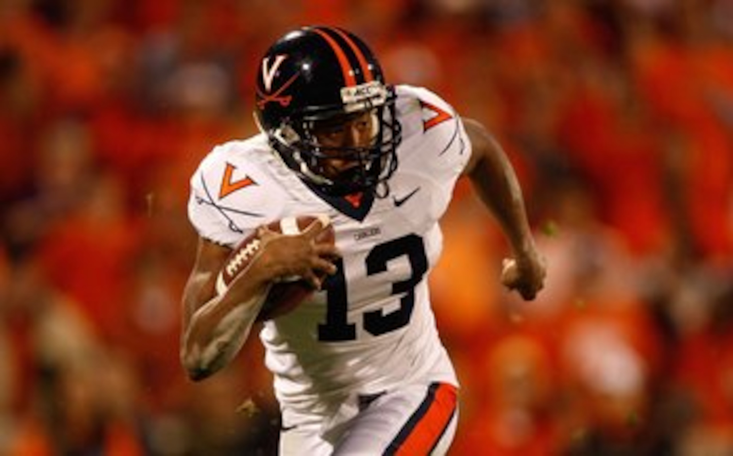 CLEMSON, SC - NOVEMBER 21:  Chase Minnifield #13 of the Virginia Cavaliers runs with the ball during the game against the Clemson Tigers at Memorial Stadium on November 21, 2009 in Clemson, South Carolina.  (Photo by Streeter Lecka/Getty Images)