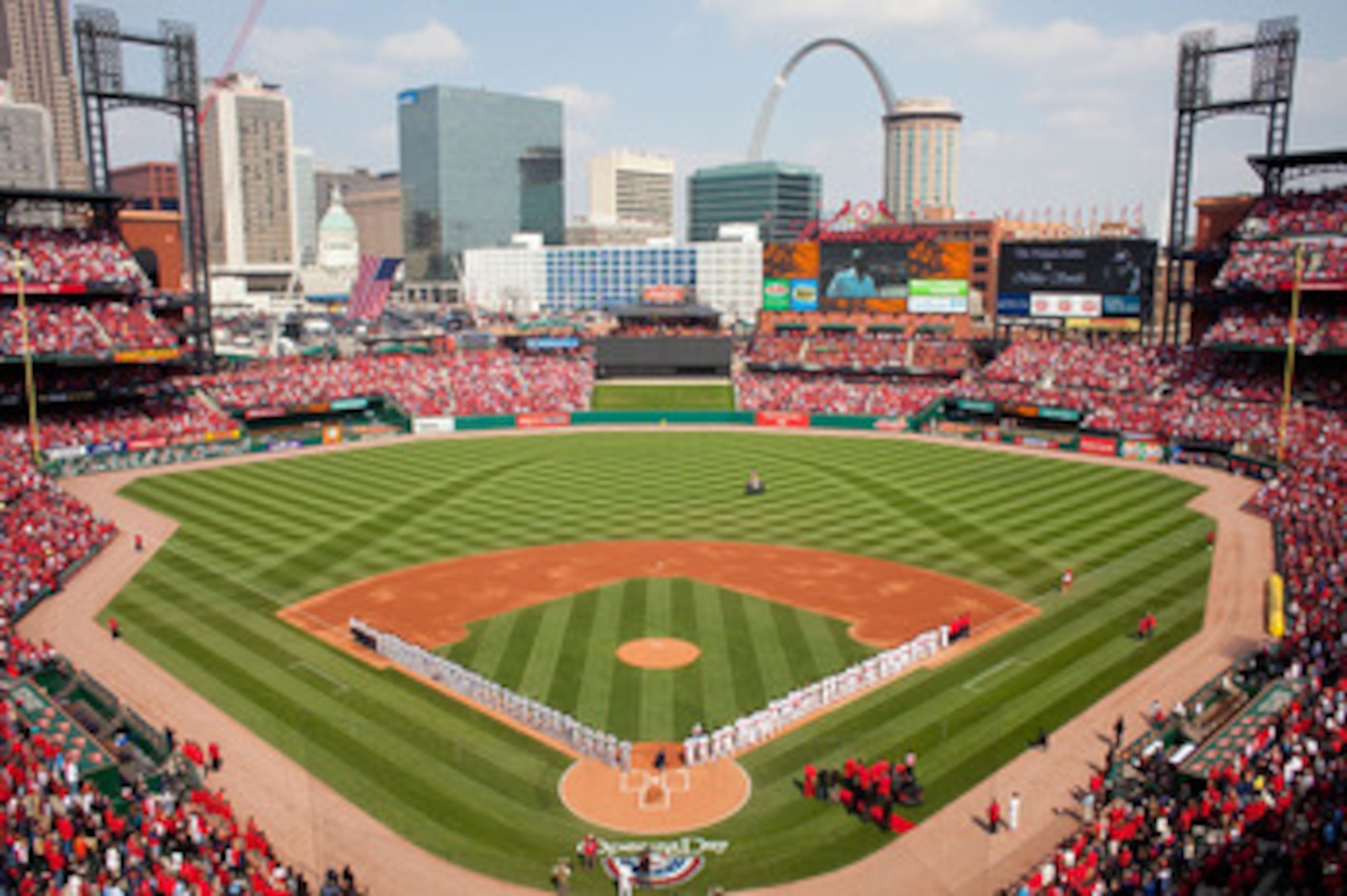 ST. LOUIS, MO - MARCH 31: Members of the St. Louis Cardinals and San Diego Padres line up for the National Anthem on opening day at Busch Stadium on March 31, 2011 in St. Louis, Missouri. (Photo by Dilip Vishwanat/Getty Images) ST. LOUIS, MO - MARCH 31: Members of the St. Louis Cardinals and San Diego Padres line up for the National Anthem on opening day at Busch Stadium on March 31, 2011 in St. Louis, Missouri. (Photo by Dilip Vishwanat/Getty Images)