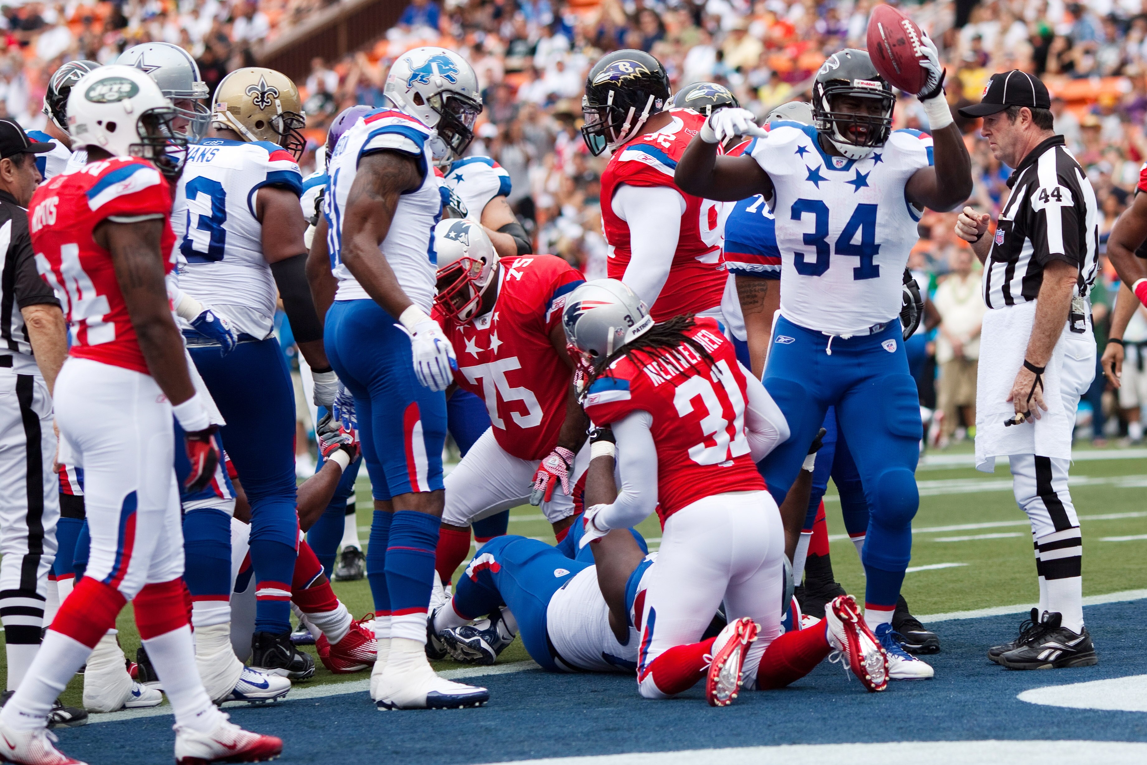 HONOLULU - JANUARY 30: Ovie Mughelli #34 of the Atlanta Falcons celebrates after the National Football Conference (NFC) team scores a touchdown against the American Football Conference (AFC) during the 2011 NFL Pro Bowl at Aloha Stadium on January 30, 201