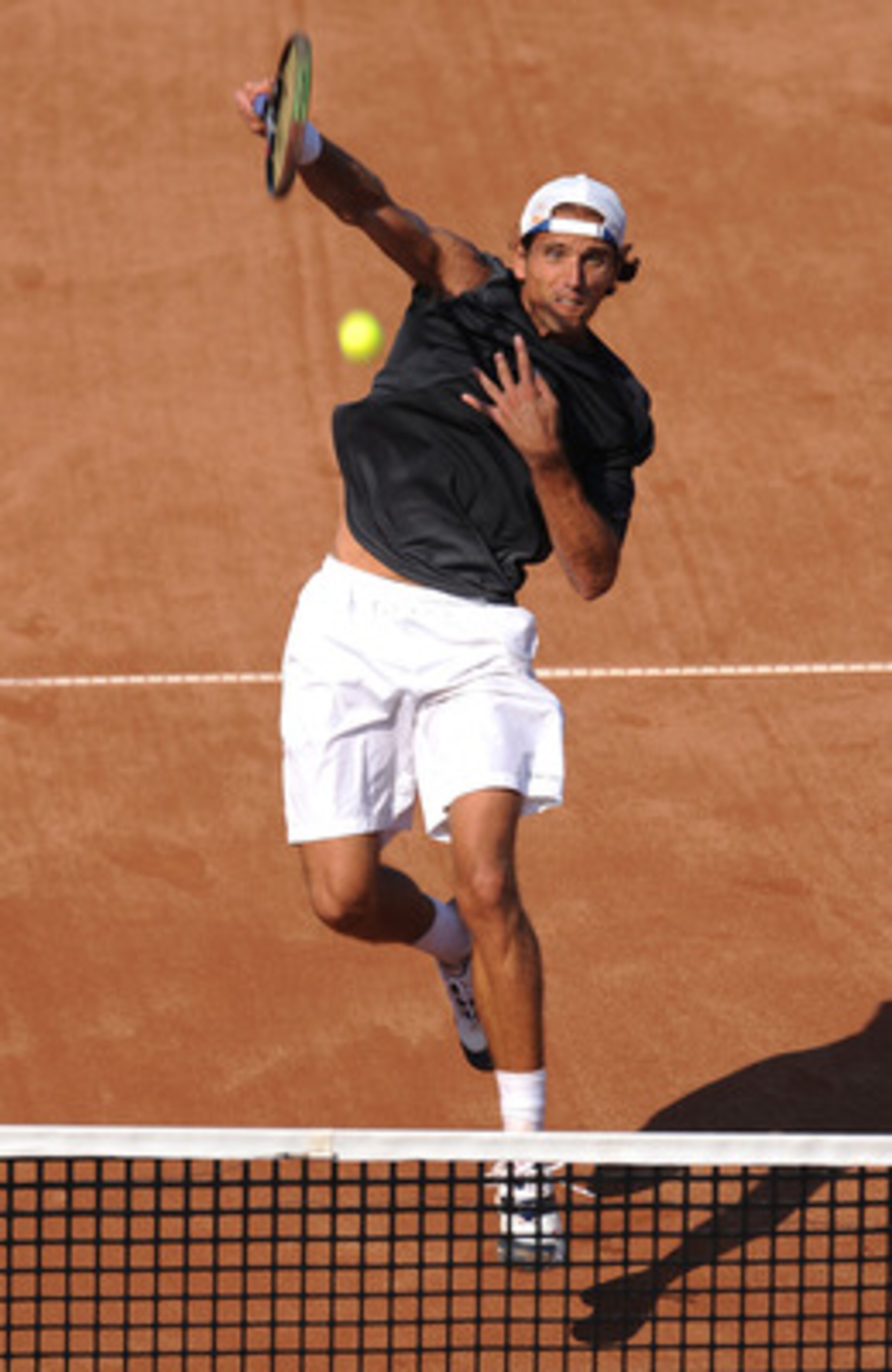BUCHAREST, ROMANIA - SEPTEMBER 23:  Ruban Ramirez Hidalgo of Spain in action against Marius Copil of Romania during Round Two of the BCR Open Romania at the BNR Arena on September 23, 2009 in Bucharest, Romania.  (Photo by Christopher Lee/Getty Images)