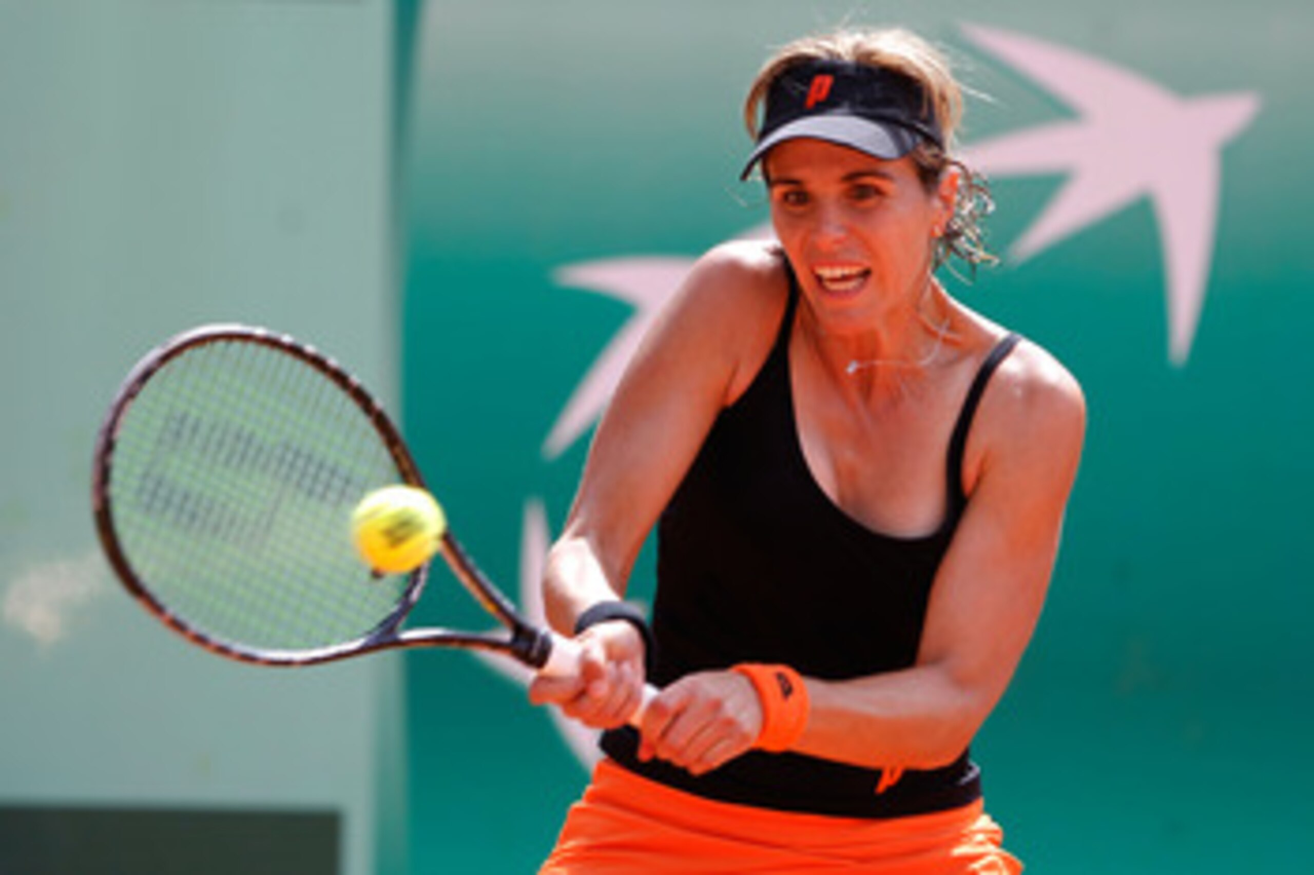 PARIS, FRANCE - MAY 22:  Maria Jose Martinez Sanchez of Spain plays a forehand during the women's singles round one match between Shahar Peer of Israel and Maria Jose Martinez Sanchez of Spain on day one of the French Open at Roland Garros on May 22, 2011