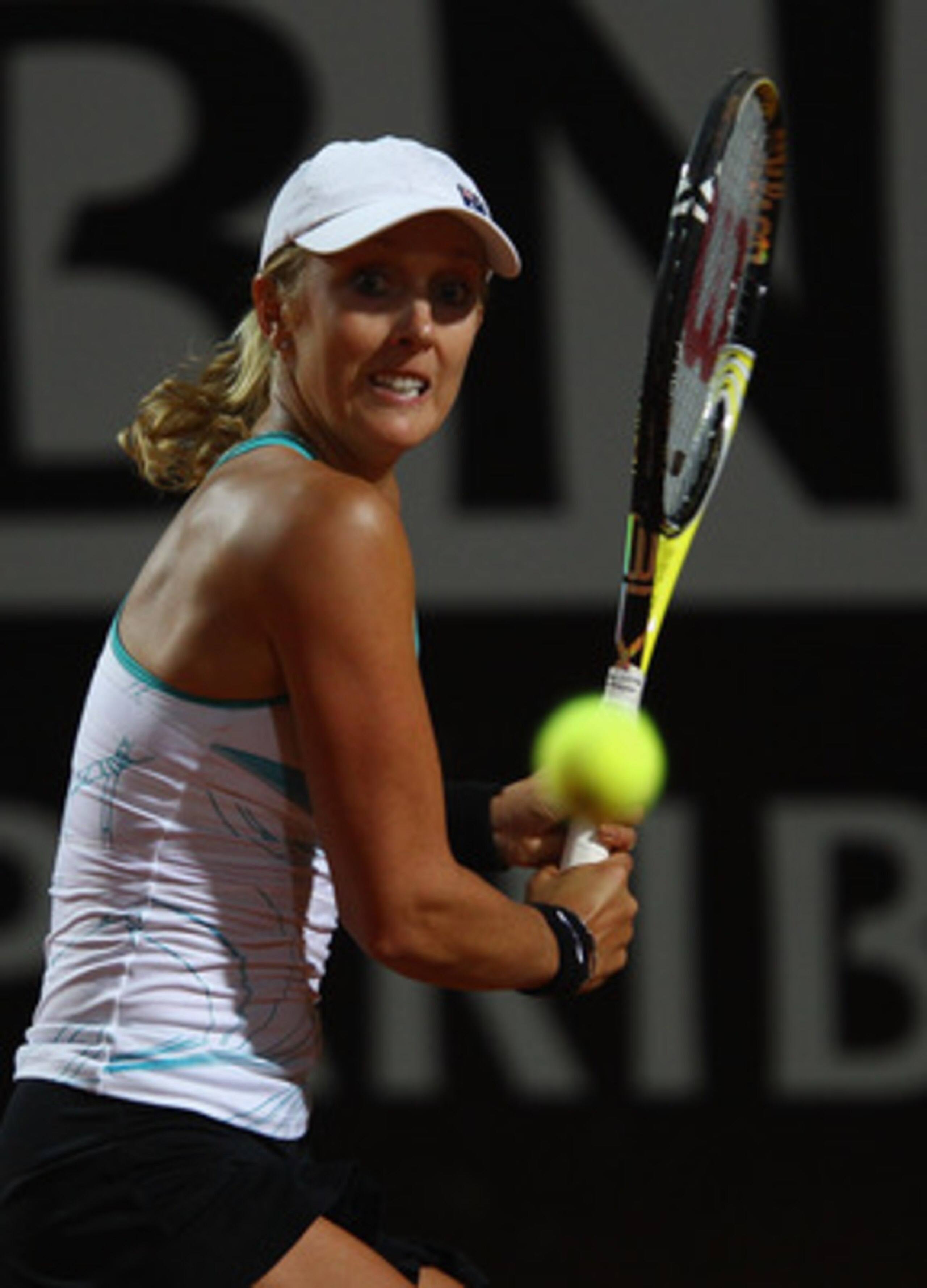 ROME, ITALY - MAY 11:  Anastasia Rodionova of Australia plays a backhand during her second round match against Caroline Wozniacki of Denmark during day four of the Internazoinali BNL D'Italia at the Foro Italico Tennis Centre on May 11, 2011 in Rome, Ital