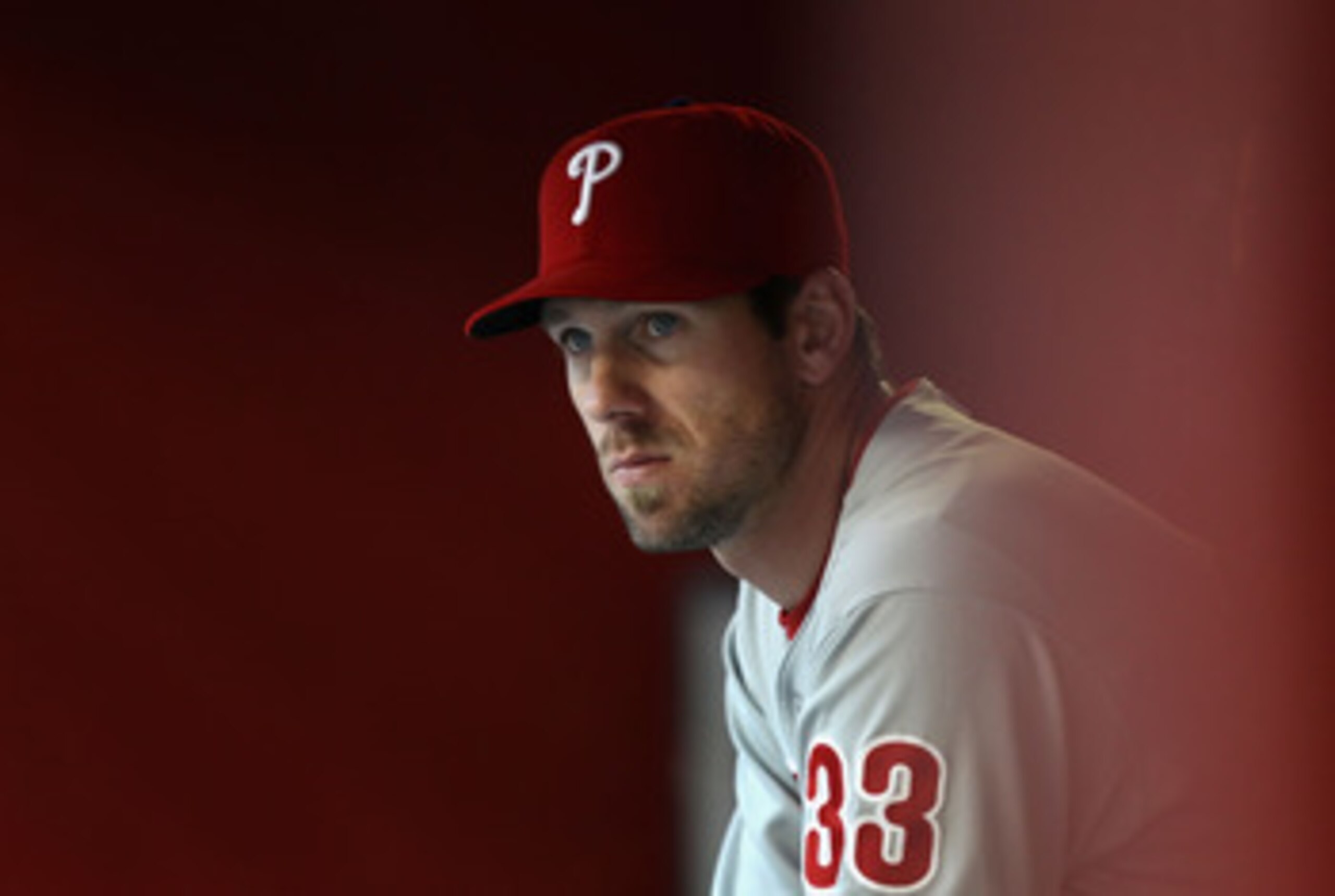 PHOENIX, AZ - APRIL 26:  Cliff Lee #33 of the Philadelphia Phillies watches from the dugout during the Major League Baseball game against the Arizona Diamondbacks at Chase Field on April 26, 2011 in Phoenix, Arizona. The Diamondbacks defeated the Phillies