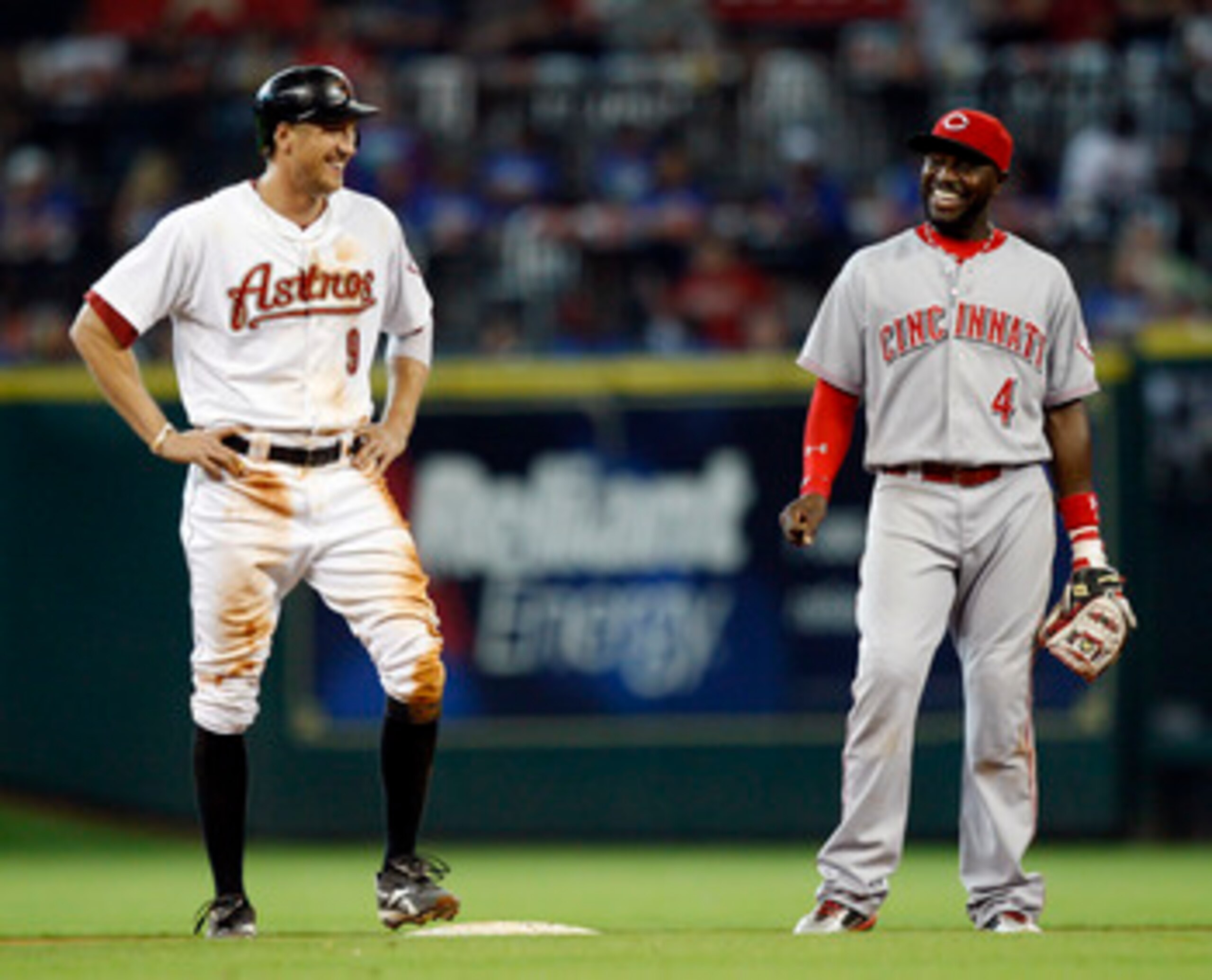 HOUSTON - MAY 11:  Hunter Pence #9 of the Houston Astros and Brandon Phillips #4 of the Cincinnati Reds chat during a break in the play after Pence doubled in the seventh inning at Minute Maid Park on May 11, 2011 in Houston, Texas.  (Photo by Bob Levey/G