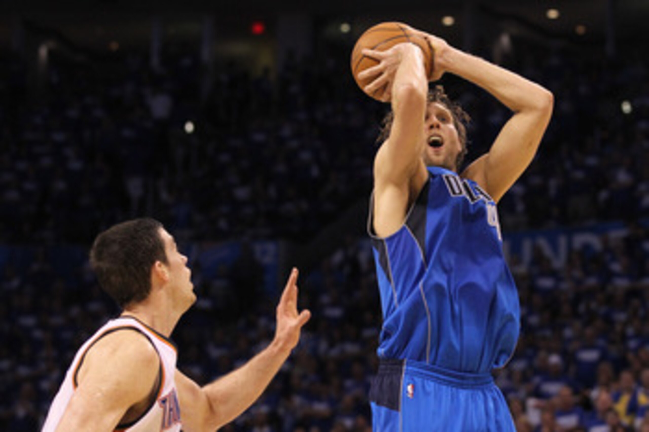 OKLAHOMA CITY, OK - MAY 21:  Dirk Nowitzki #41 of the Dallas Mavericks goes up for a shot against Nick Collison #4 of the Oklahoma City Thunder in Game Three of the Western Conference Finals during the 2011 NBA Playoffs at Oklahoma City Arena on May 21, 2