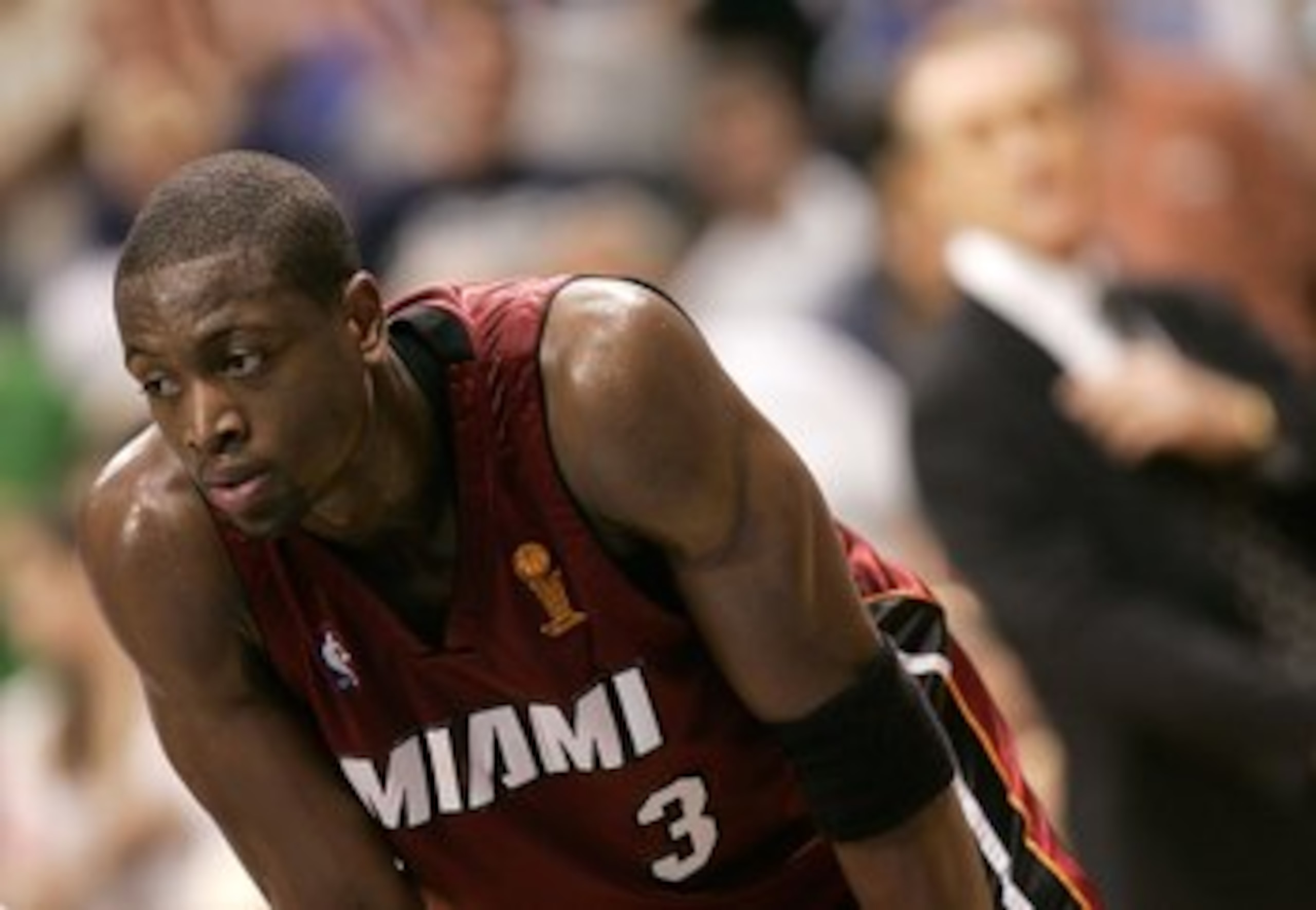 DALLAS - JUNE 20:  Dwyane Wade #3 of the Miami Heat stands on the court as head coach Pat Riley of the Heat looks on in the background during the second quarter agianst the Dallas Mavericks in game six of the 2006 NBA Finals on June 20, 2006 at American A
